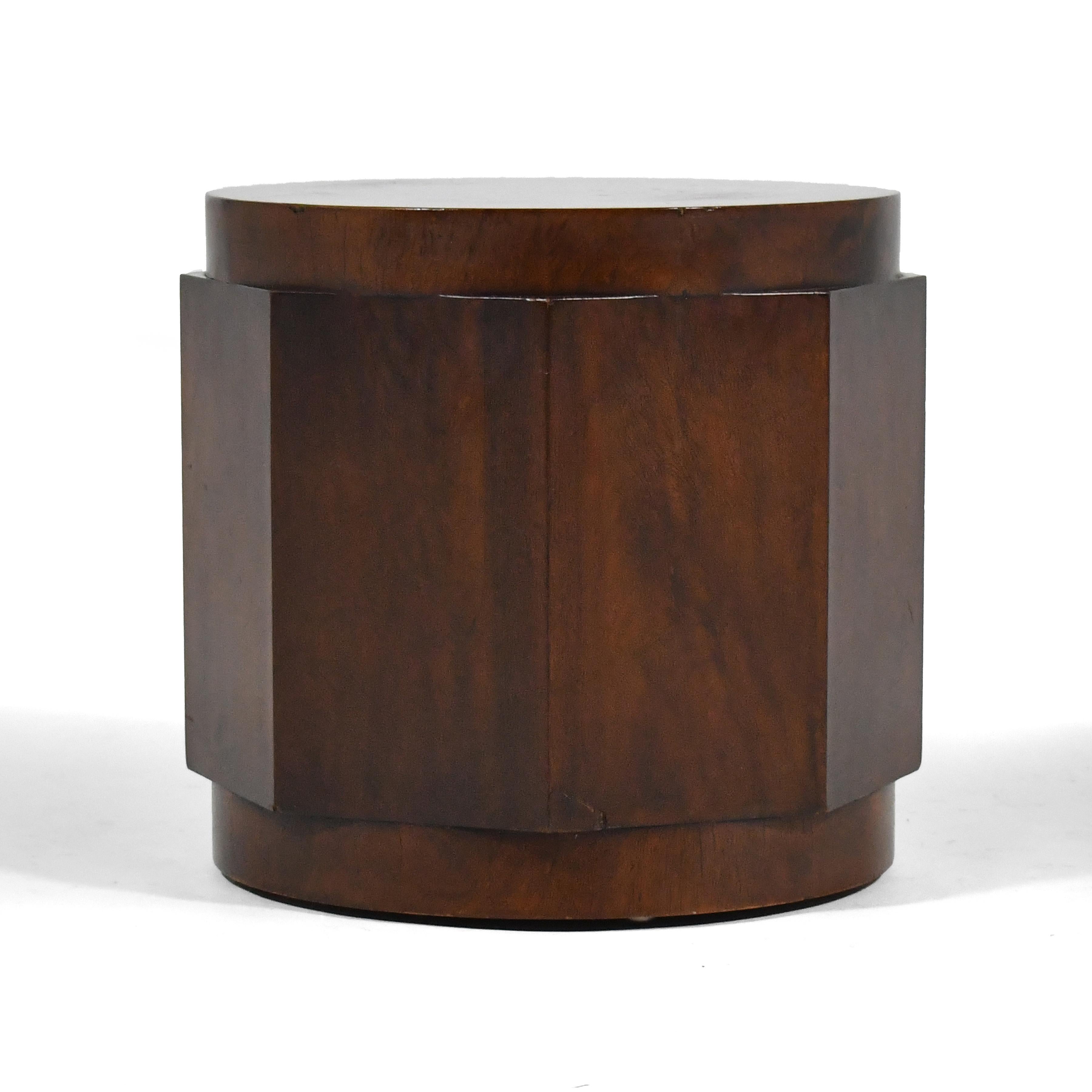 This table is an early design by Ed Wormley for Dunbar is a cylindrical form of mahogany with hexagonal faceted sides. It can serve as a side table, or with the addition of a larger piece of glass, a coffee table. We acquired it from the original