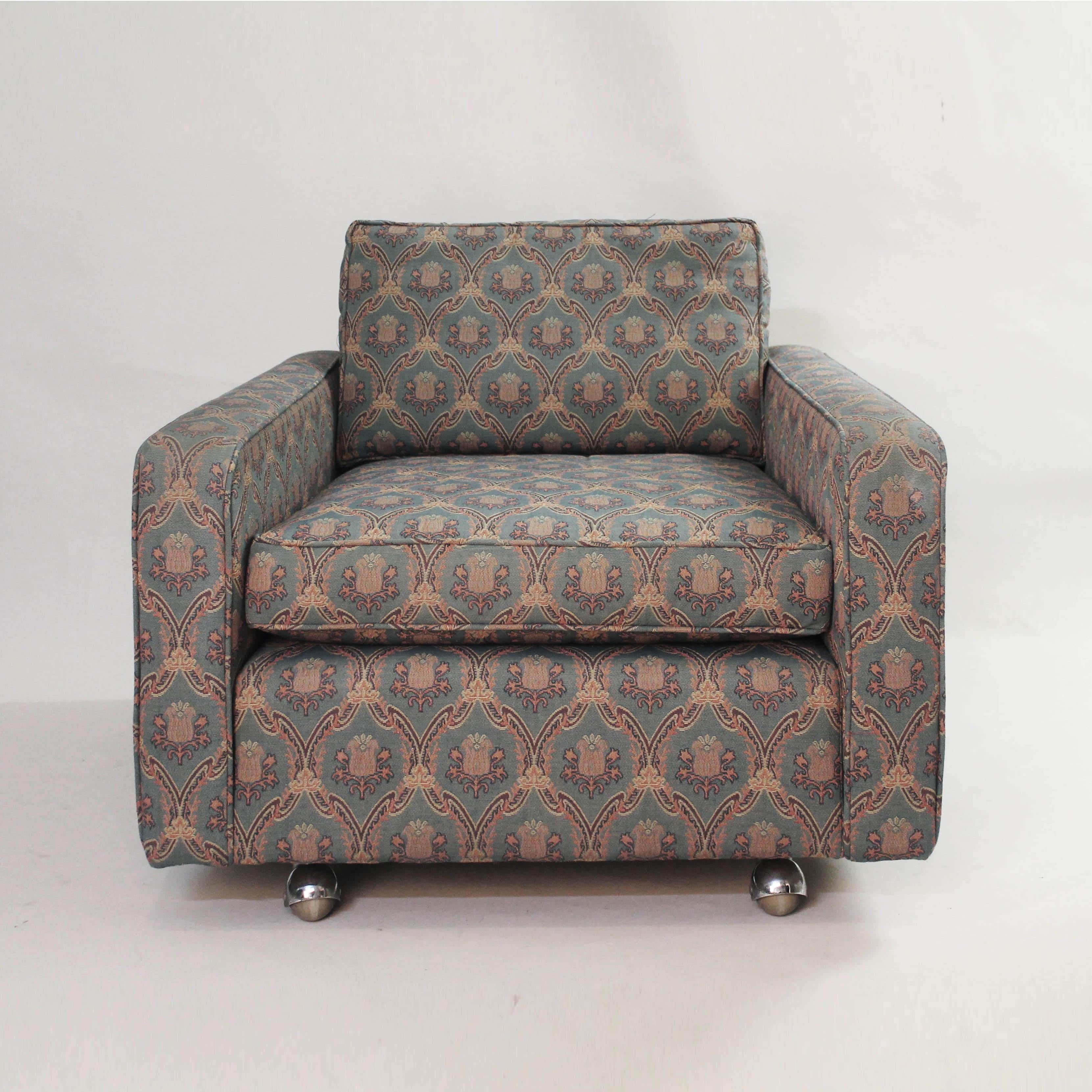 Edward Wormley lounge armchair for Dunbar on four chrome ball wheels. The armchair needs reupholstery and some love. In house upholstery available. The perfect armchair to upholster in the fabric that matches your interiors. 
Also available, a