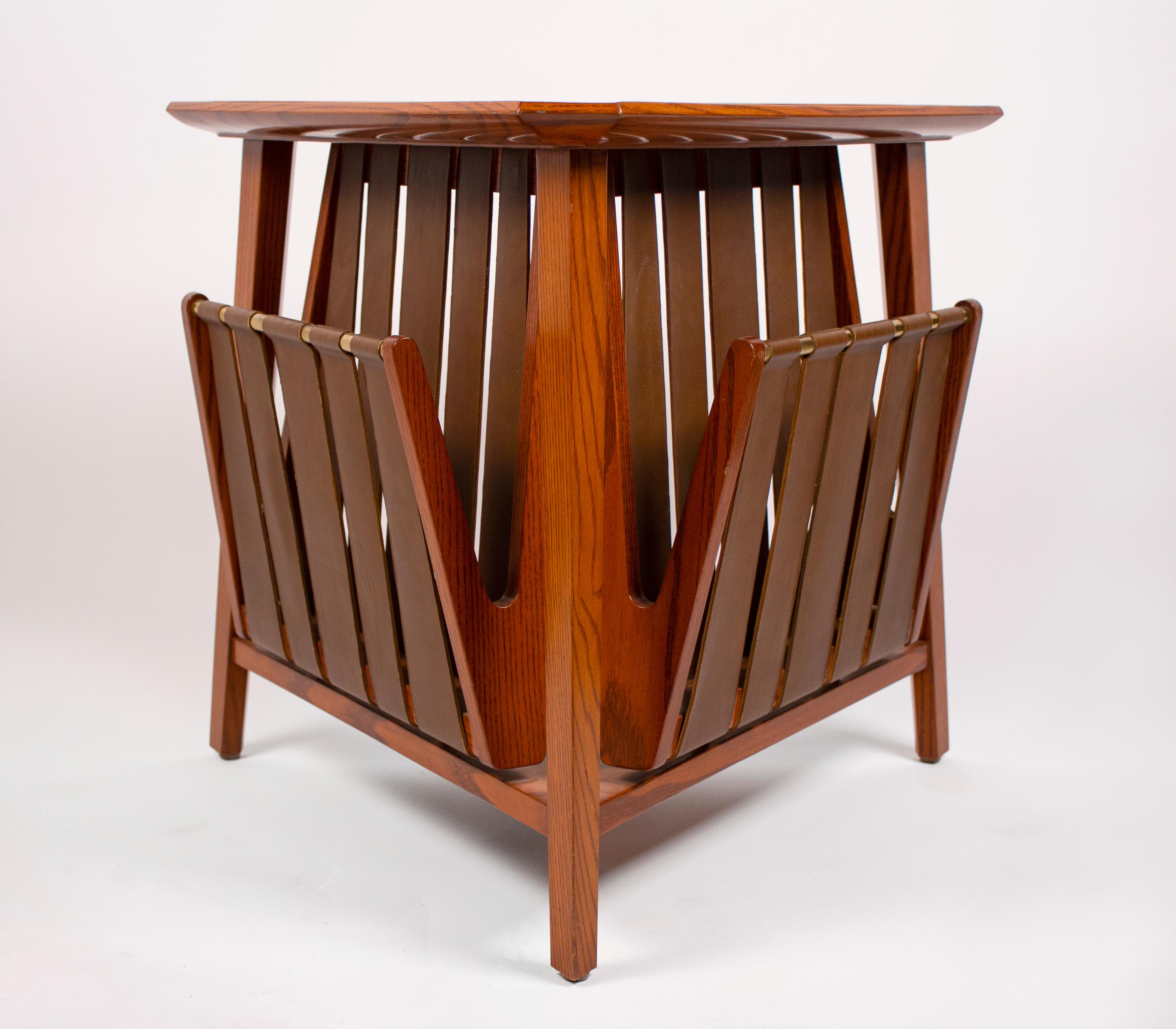 Magazine table by Edward Wormley for Dunbar, 1959. Table constructed of oak, brass and leather, very good original condition.