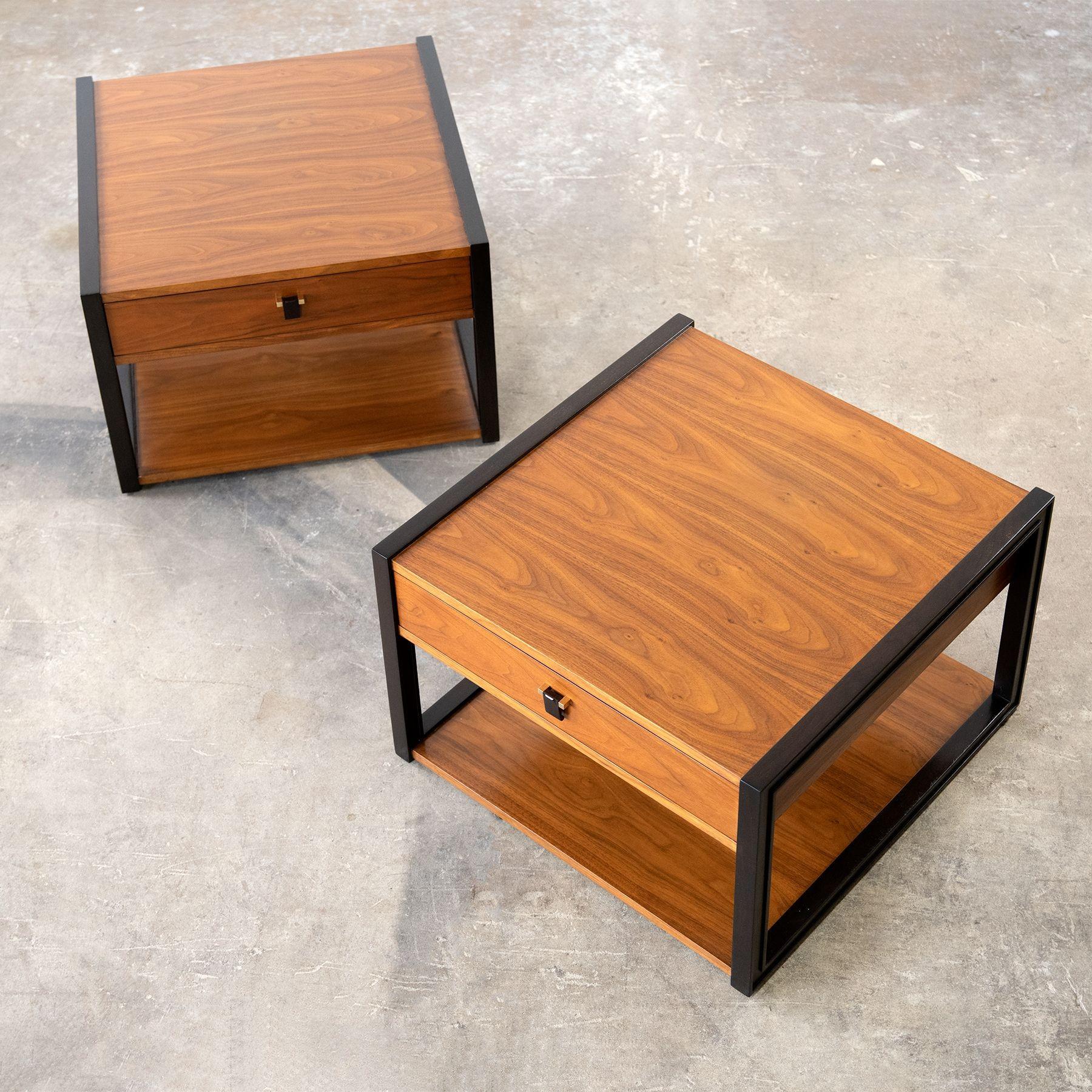 These extraordinarily beautiful and generously proportioned nightstands were designed by Edward Wormley for Dunbar and manufactured in the 1960s.
Bookmatched American walnut woodgrain drawer floating between two espresso colored mahogany frames.