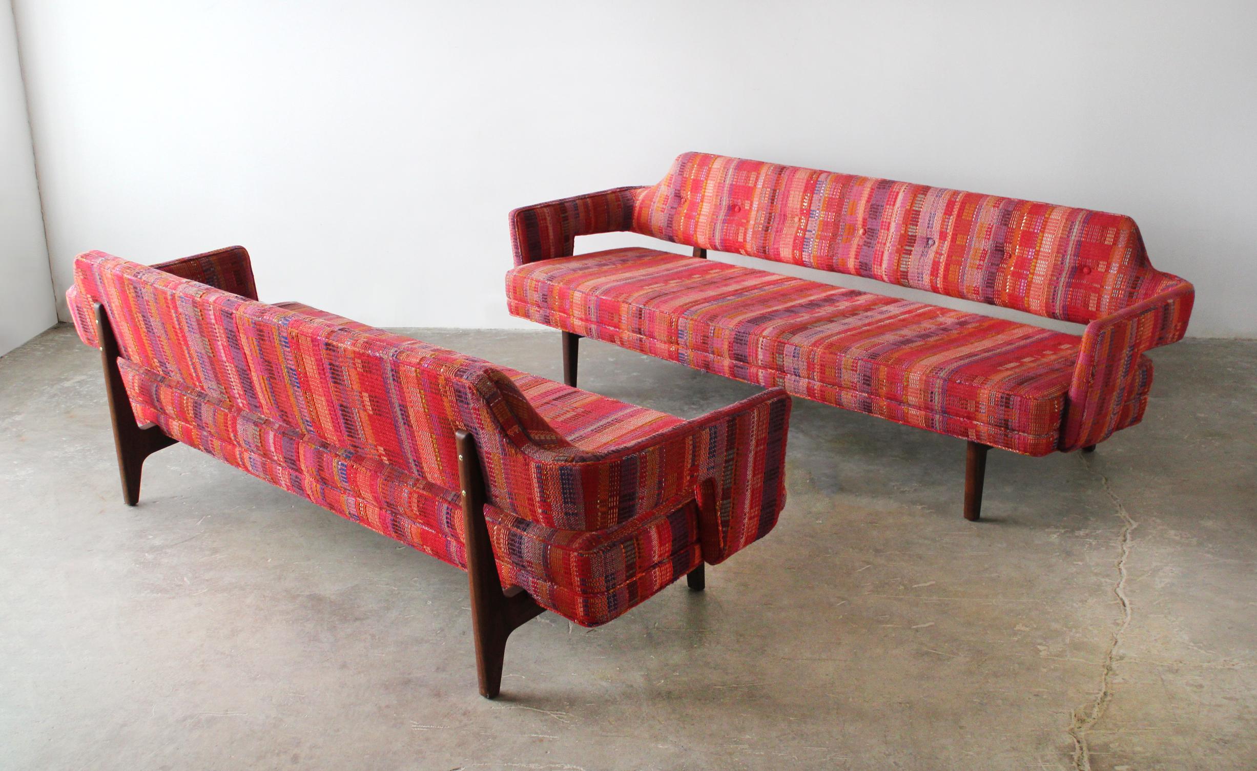 This is an early rare pair of floating back sofas designed by Edward Wormley for Dunbar model 6133. They are upholstered in the original Dorothy Liebes loom-woven textile and were acquired from an architect's private collection. Oiled walnut frames.