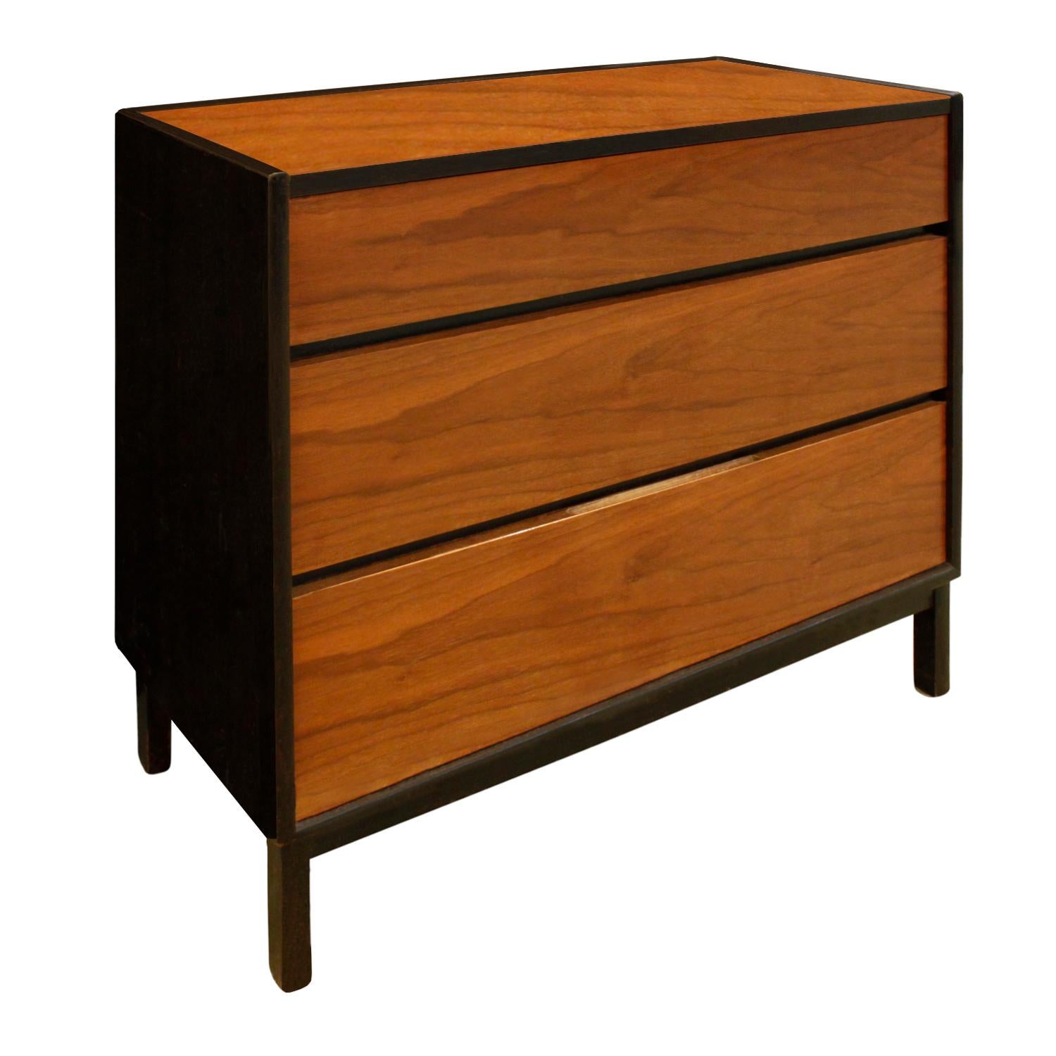 Pair of clean line bedside tables / chests model no. 500 in teak and dark mahogany with 3 drawers by Edward Wormley for Dunbar, 1960s (signed with Dunbar tags). These are beautifully crafted in luxurious materials.