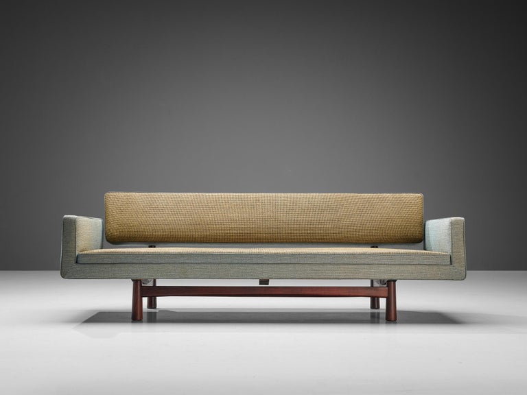 Edward Wormley for Dunbar Furniture / DUX of Sweden, sofa model 5316, wool, stained beech, brass, United States, design 1952

This three-seat sofa was designed by Edward Wormley for Dunbar in 1952. The eye-catching greyish blue and khaki wool