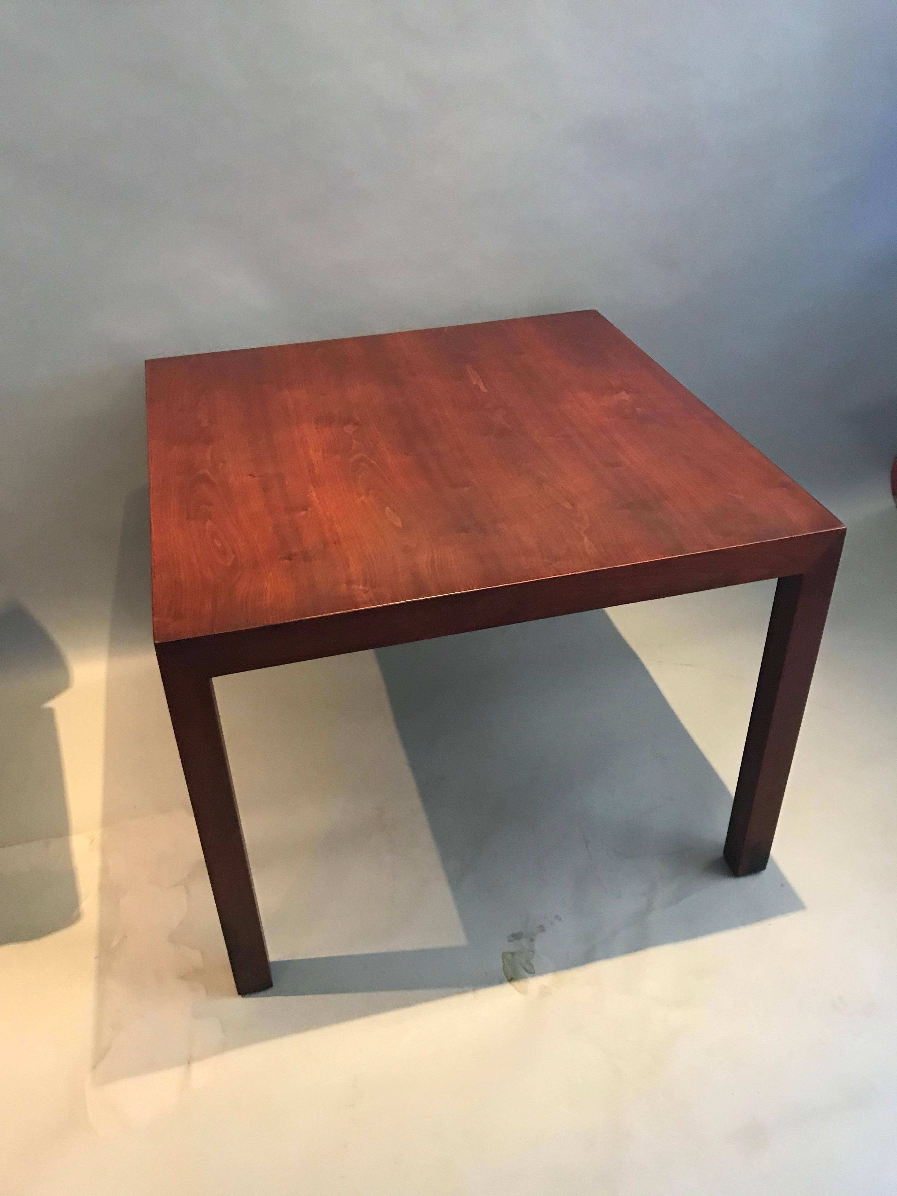 Gorgeous side or end table designed by Edward Wormley for Dunbar. A lovely walnut patina accompanies the evening and dramatic walnut grain patterns. Even color throughout with normal wear. The table is large enough to display a sculpture, plants, or