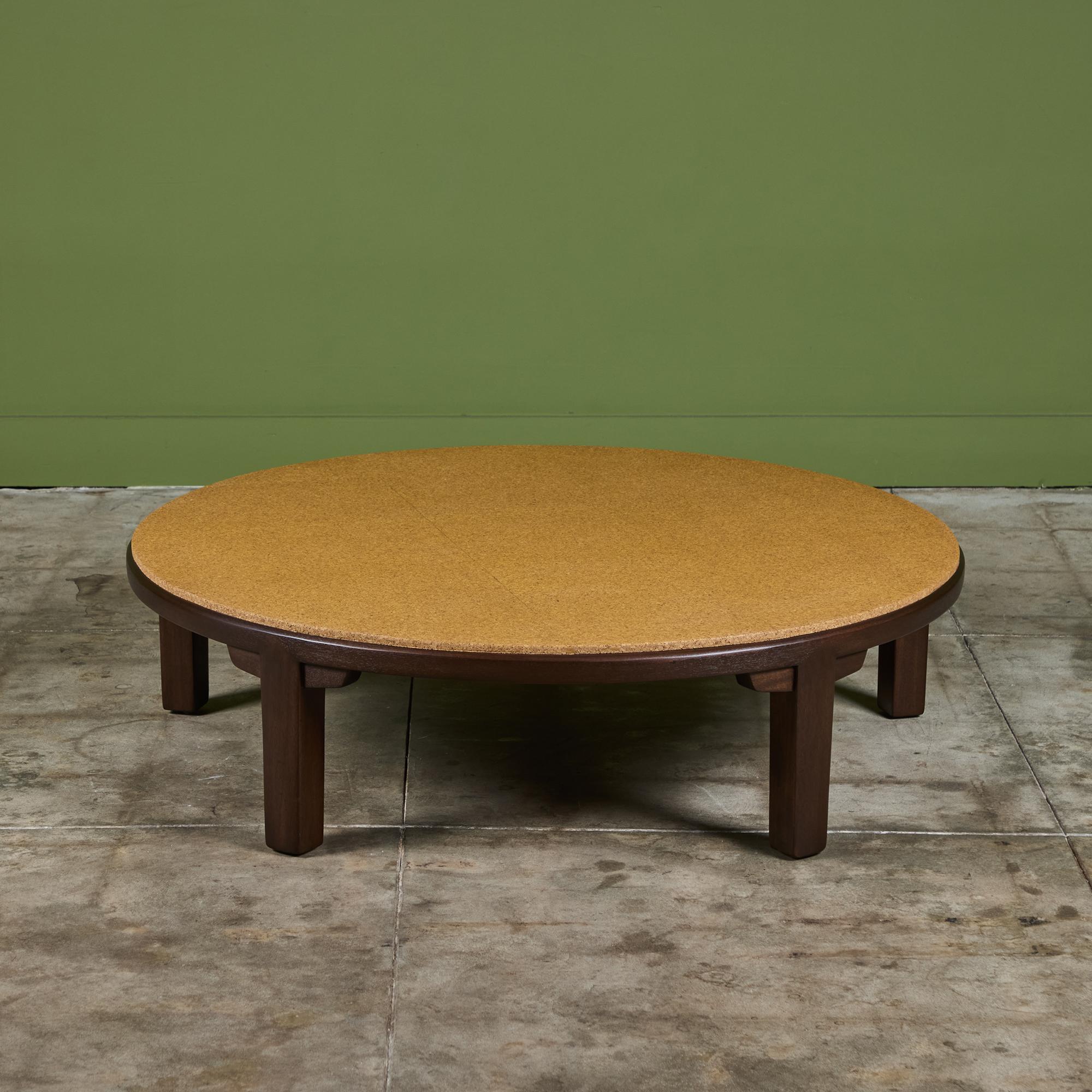 Edward Wormley round coffee table for Dunbar c.1950s, USA. The table showcases a beautiful cork table top and mahogany frame. Retains the Dunbar label.

Dimensions
48.5