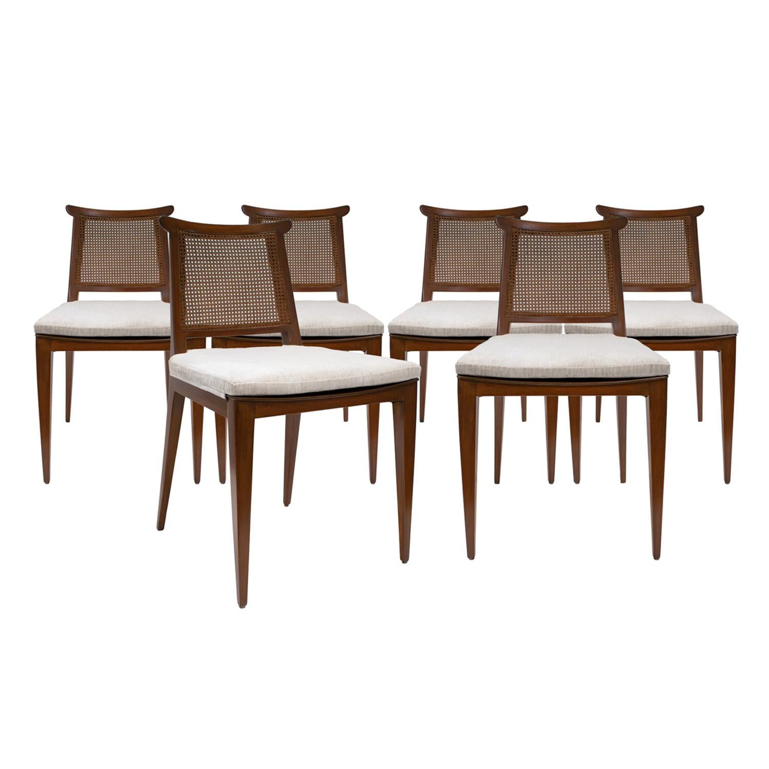 Set of 6 elegant dining chairs model no. 4632S in mahogany with cane backs and upholstered seats by Edward Wormley for Dunbar, American 1940's. These iconic Dunbar chairs are very comfortable. Newly refinished and newly reupholstered in textured