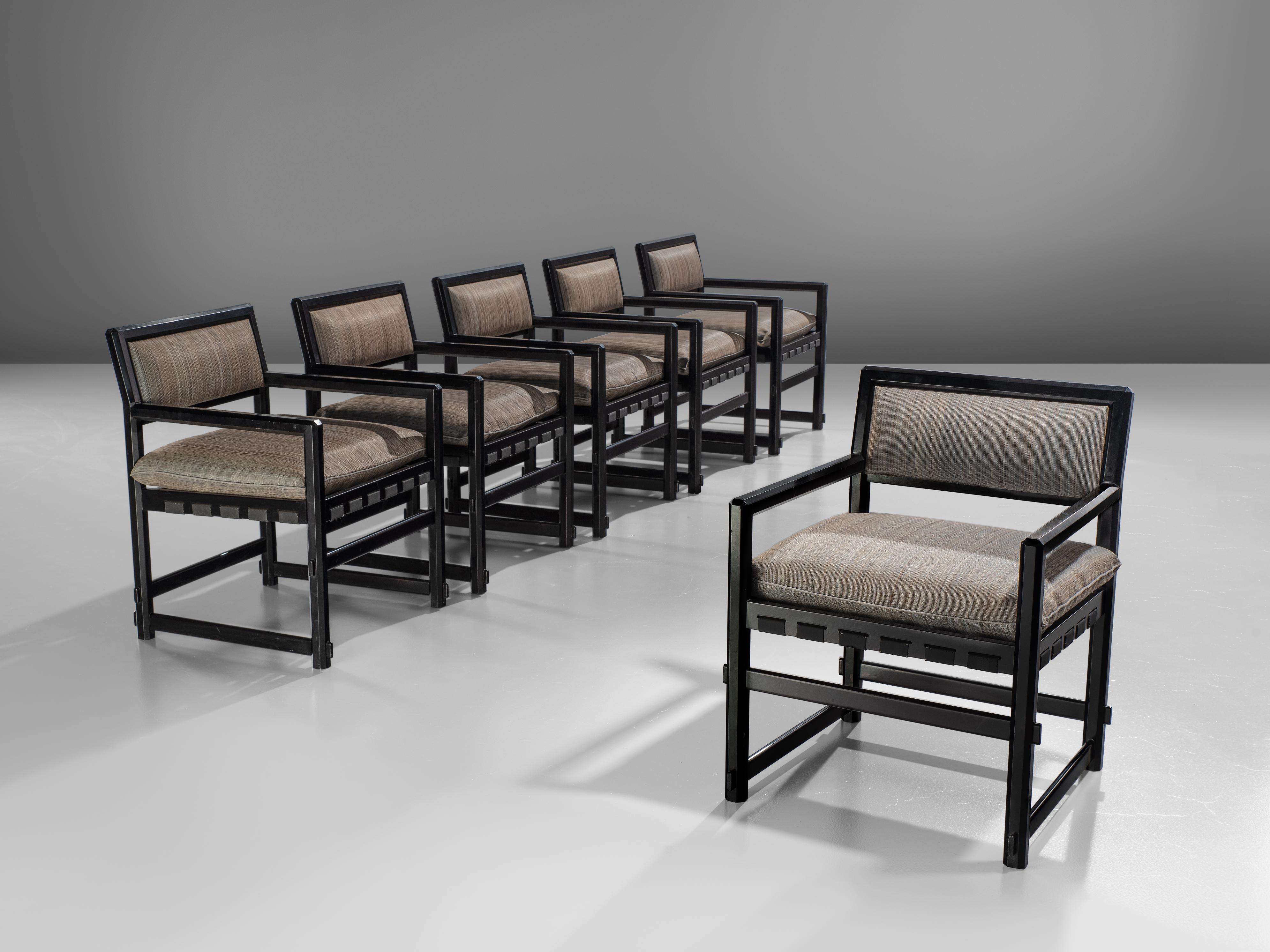 Set of six armchairs, lacquered black wood and fabric, design by Edward Wormely for Dunbar executed by Mobilier Universel, Jules Wabbes, Belgium, 1960s.

This set of six grand armchairs is executed with a rare black lacquered frame and soft striped