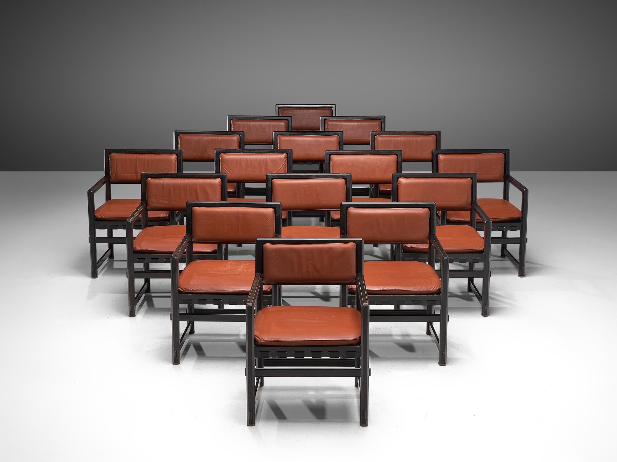 Edward Wormley for Dunbar executed by Mobilier Universel, set of 16 armchairs, lacquered black wood and leather, Jules Wabbes, Belgium, 1960s.

This set of sixteen grand armchairs is executed with a rare black lacquered frame and a brown/red colored