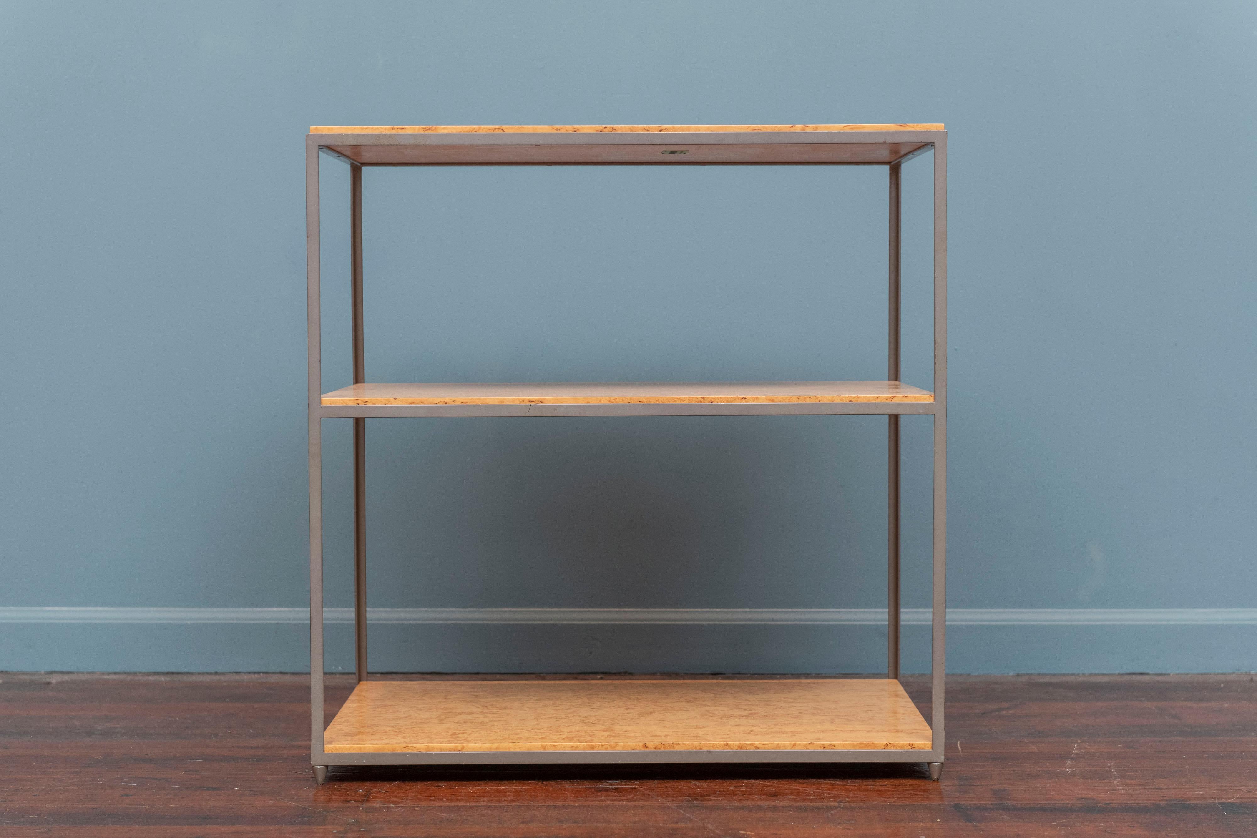 Edward Wormley design shelf for Dunbar. Early and rare design made with an original taupe painted steel frame on bullet shape feet and three burl wood shelves that have been newly refinished, labeled.
