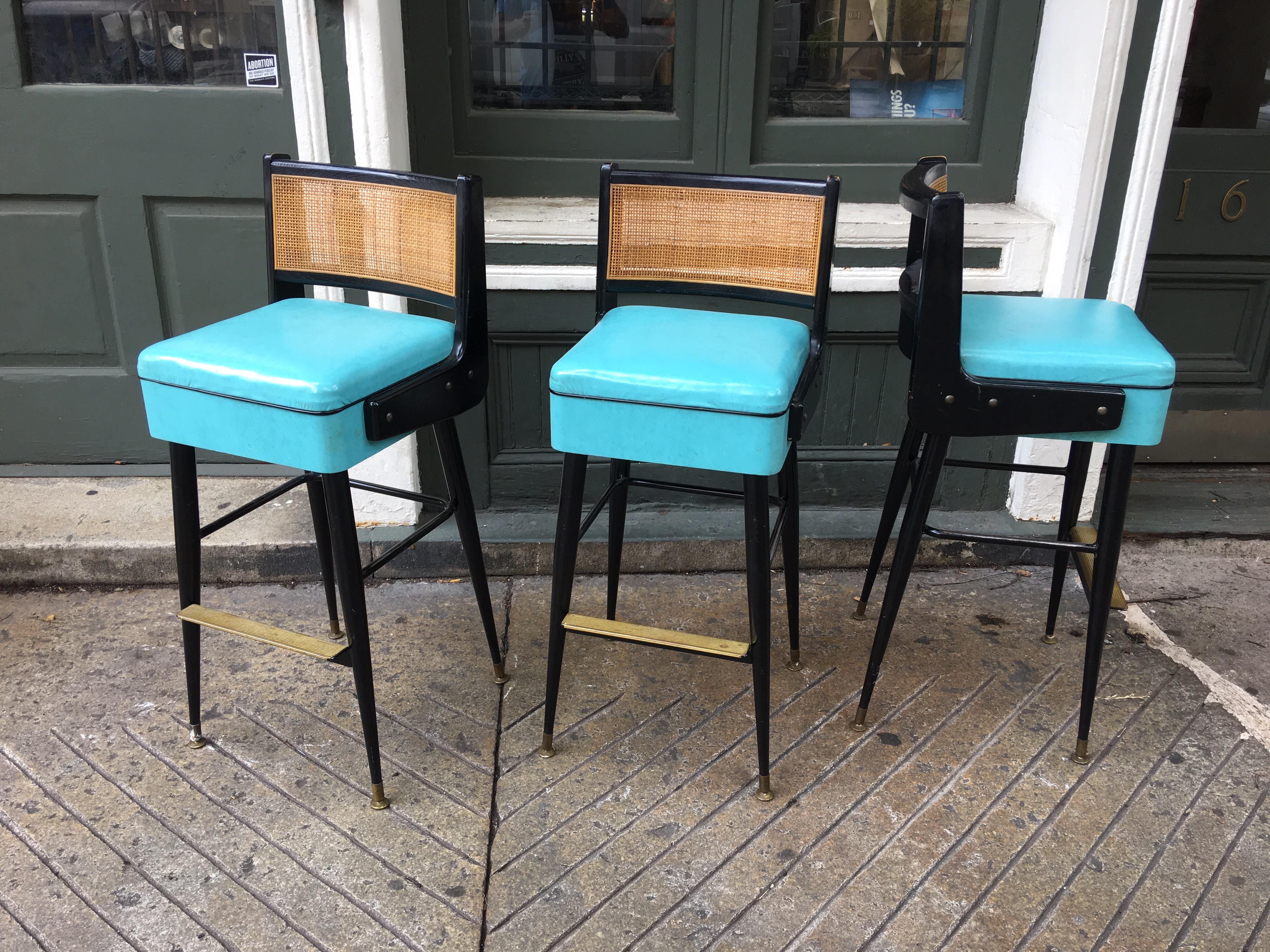 Edward Wormley style bar stools by Brody Furniture. Probably from the early 1960s! Great blue vinyl seats with painted black frames and caned backs.