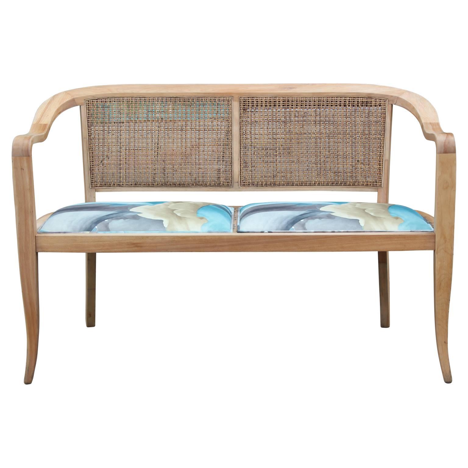 Gorgeous Edward Wormley style bench with bleached wood and cane back. Striped and Bleached wood finish with newly reupholstered cushions.