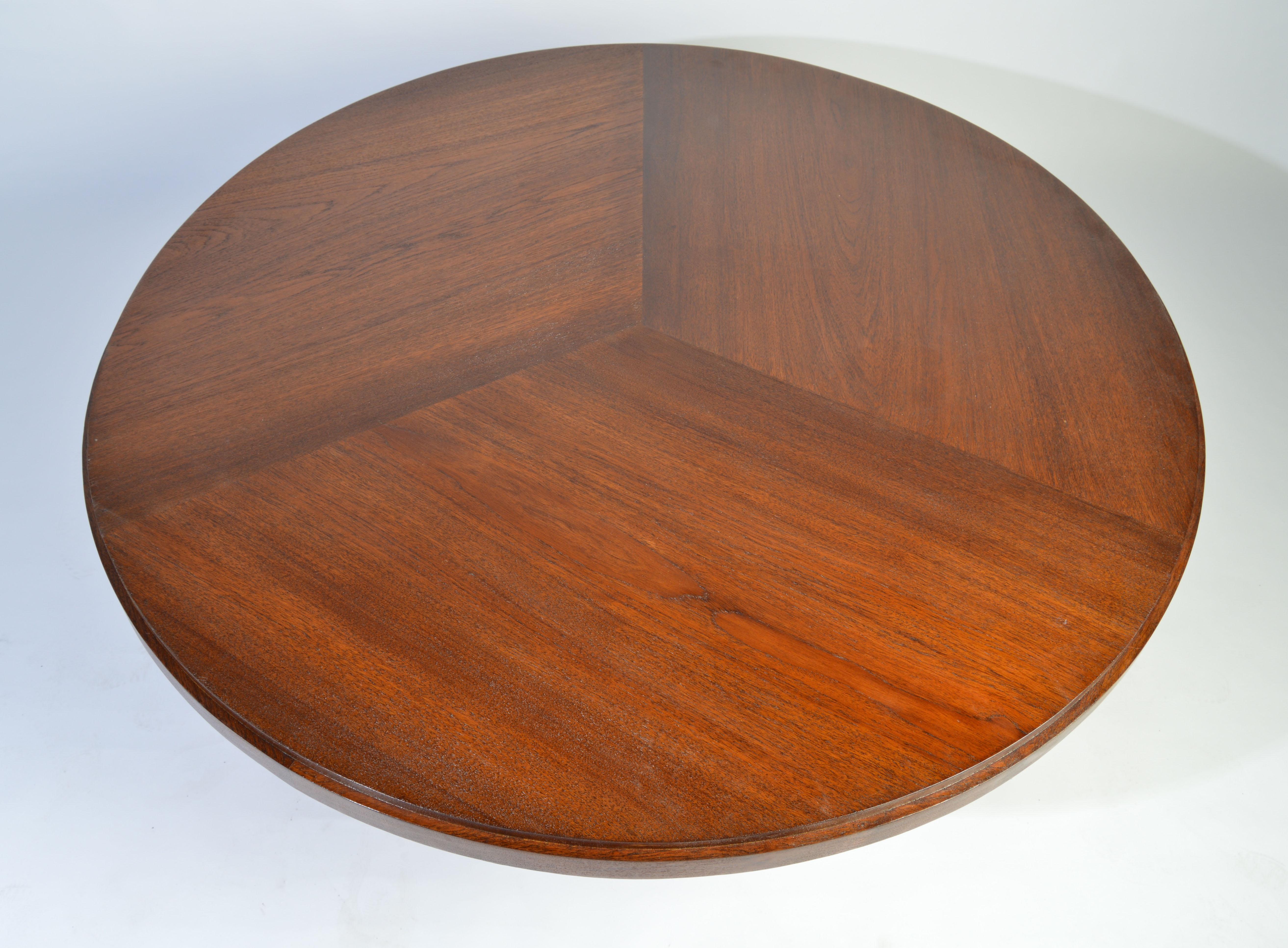 A monumental midcentury teak center table in the manner of Edward Wormley or Biedermeier. 
Excellent condition having a clean finish and sound structure.