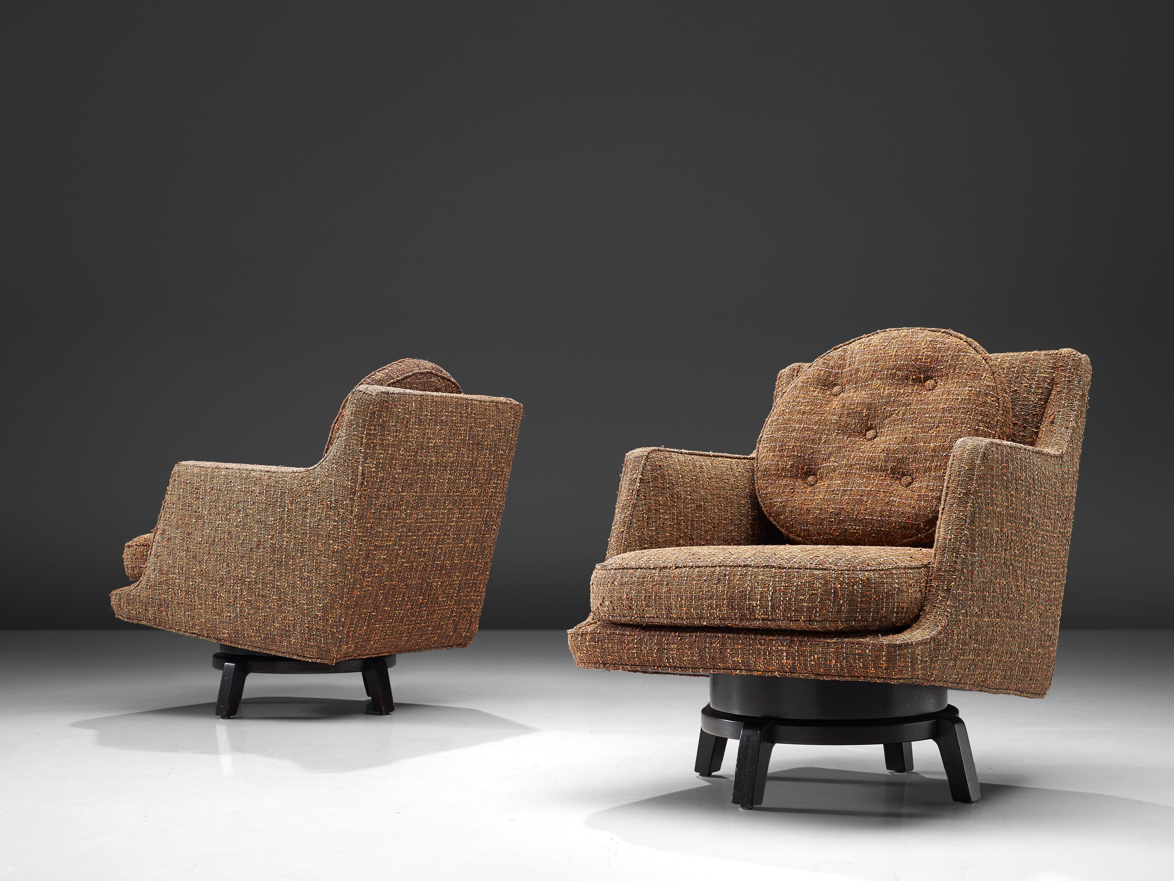 Edward Wormley, swivel lounge chairs model 5609, fabric, mahogany, United States, 1950s

These lounge chairs by Edward Wormley feature are a combination of a traditional designed seat with a wooden base that holds more playful aesthetics. The chairs