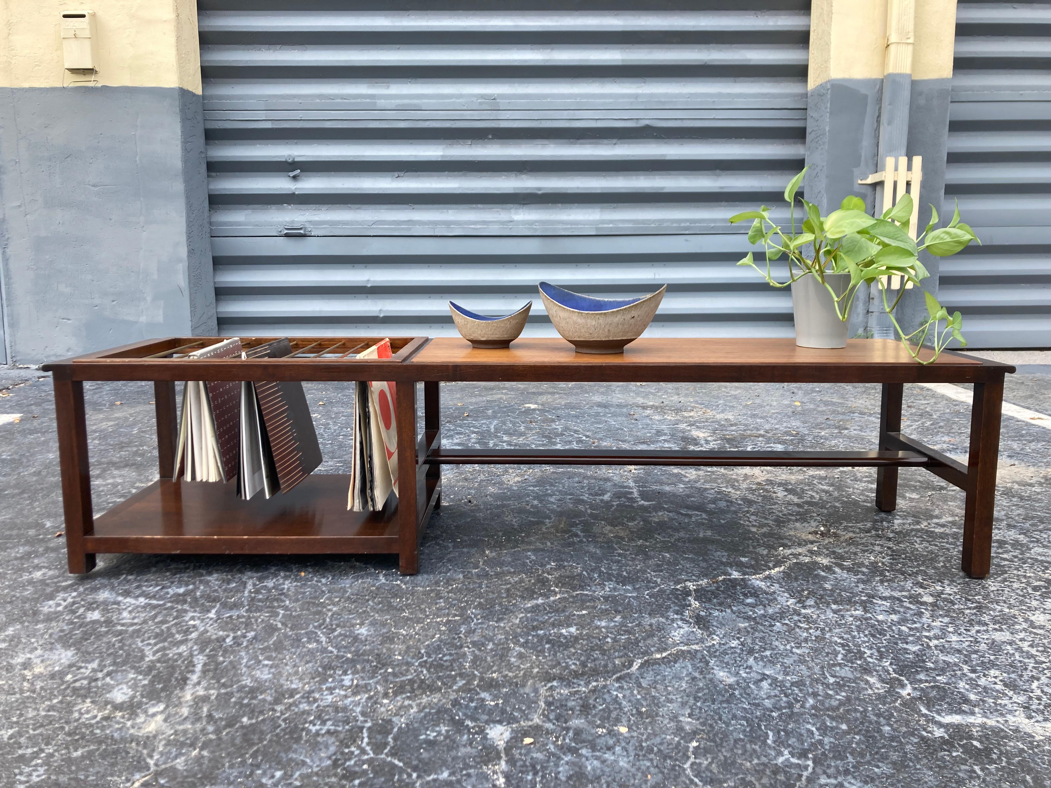 Cool Dunbar table/ bench/ magazine rack designed by Edward Wormley. Mahogany and brass.