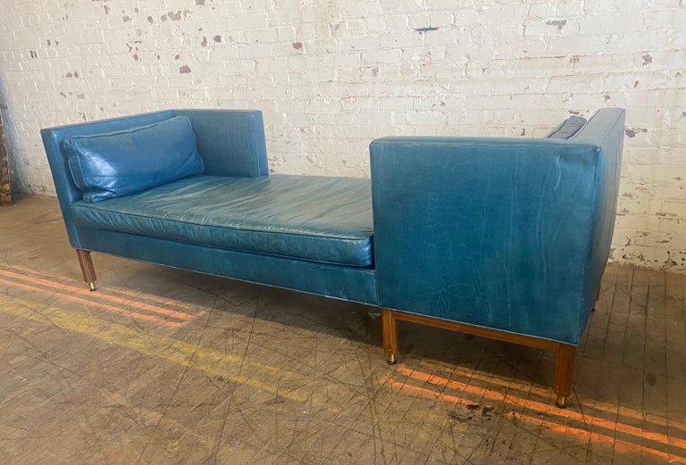 Amazing Edward Wormley for Dunbar Tete-a-Tete sofa in its original baby blue leather upholstery. Mahogany legs, brass caps. Stunning design. Outragious color and patina. Just enough wear. Hand delivery avail to New York City or anywhere en route