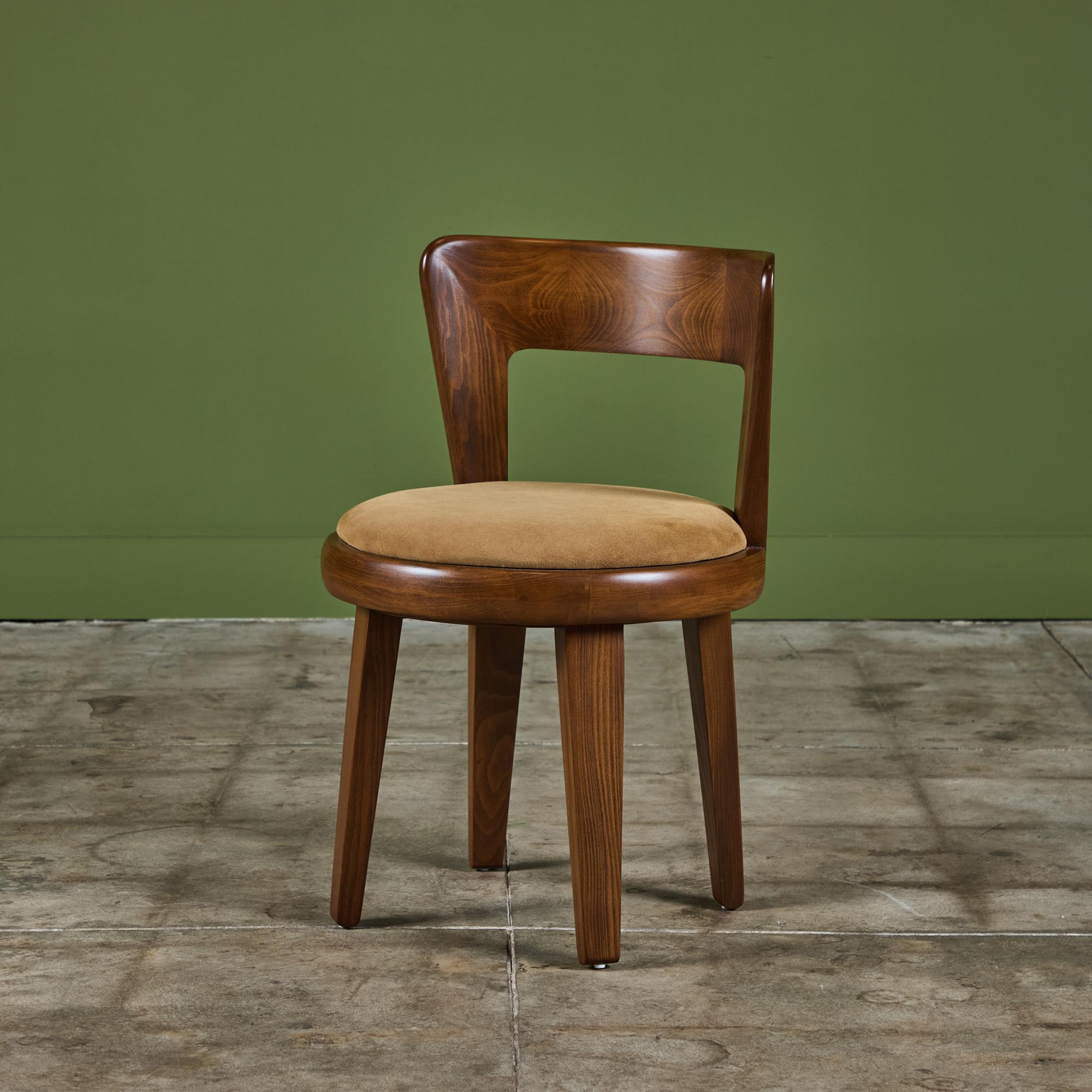 Vanity stool from Drexel’s notable Precedent line, one of the few collections Edward Wormley produced outside of his work with Dunbar. The stately collection is comprised of over 100 pieces for each room of the home. This stool features a newly