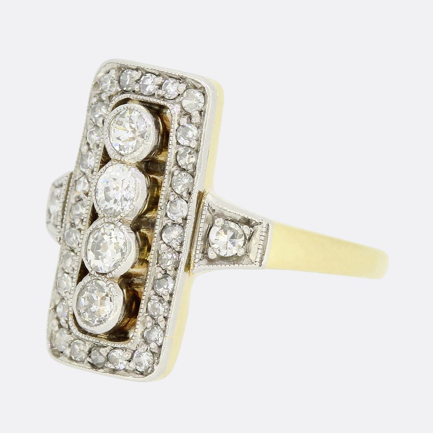 This is a lovely 18ct yellow gold Edwardian diamond tablet ring. The centre of the ring is formed of 4 old cut diamonds and surrounded by a border of sparkling single cut diamonds. The tablet style is a typical Edwardian look which has remained as