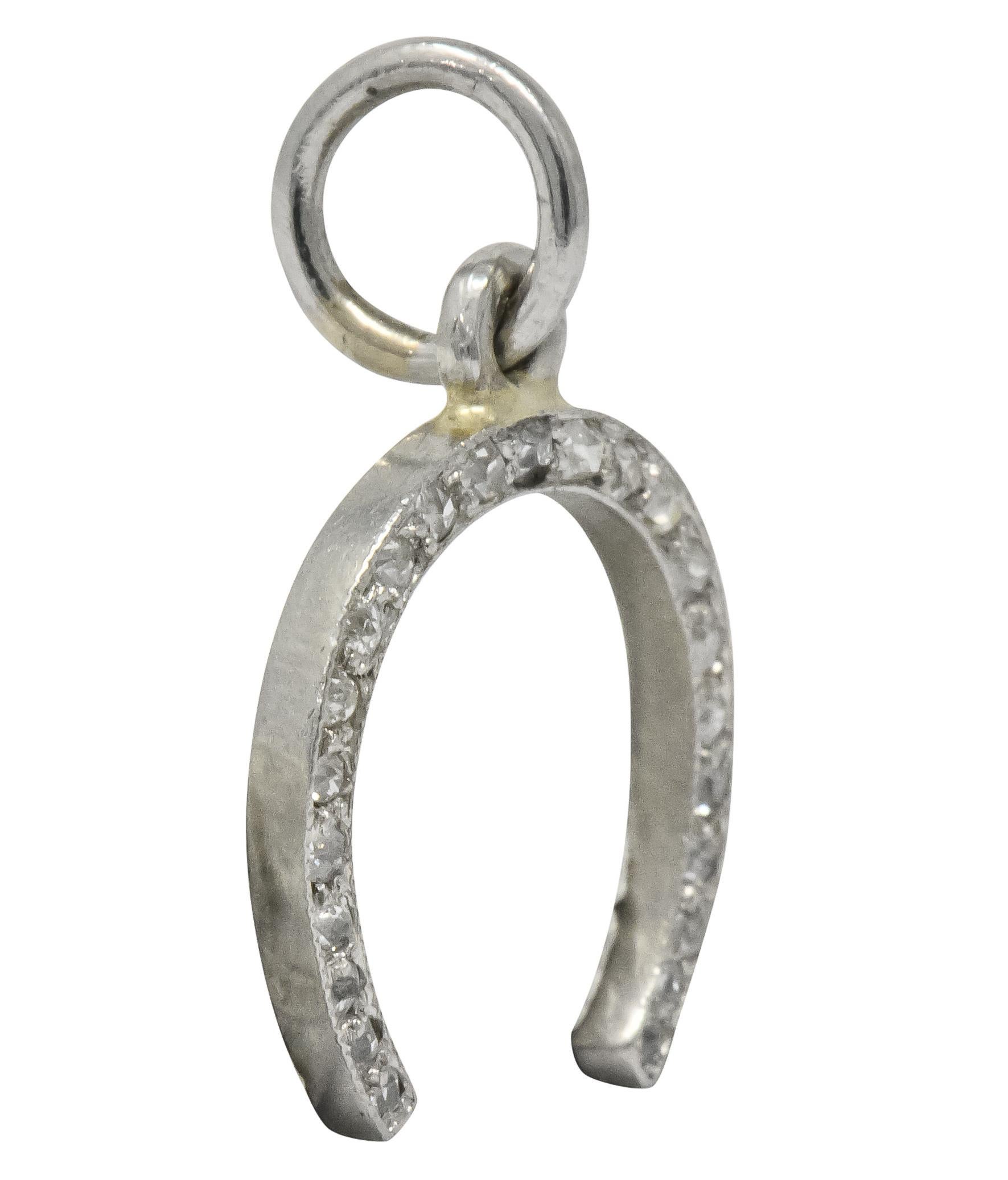 Horseshoe charm bead set with rose cut and Swiss cut diamonds weighing approximately 0.37 carat total, H to I color and SI clarity

With millegrain edge 

Completed by jump-ring

Tested as platinum

Circa 1920

Measures: 5/8 x 3/4 (including bale)
