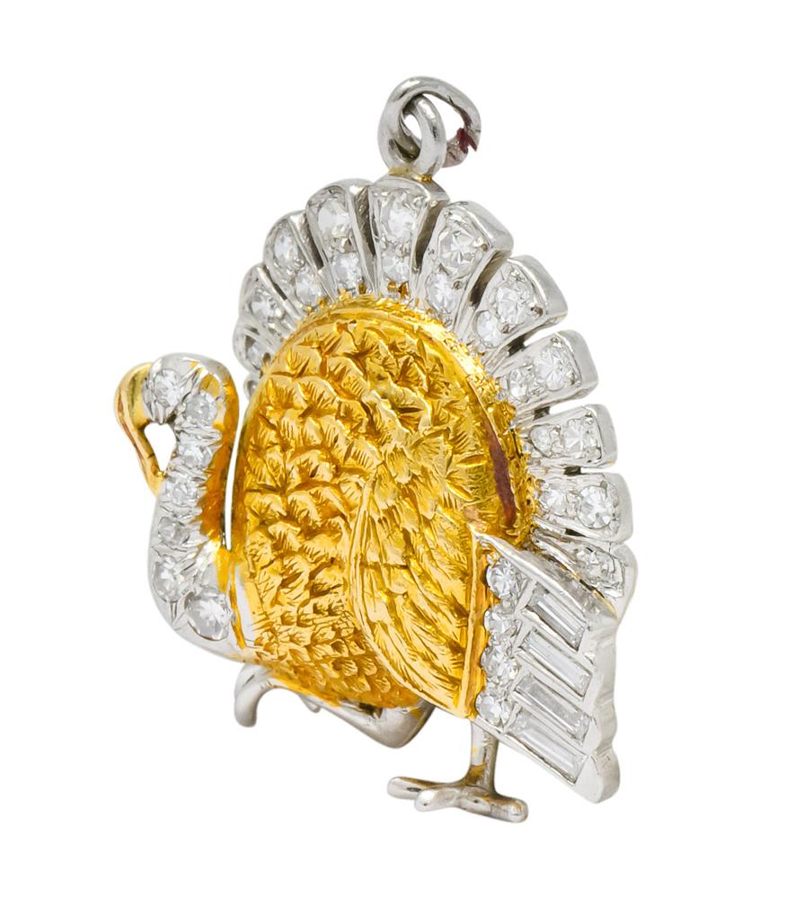 Designed as a detailed turkey in 18 karat yellow gold with platinum accents

With approximately 0.38 carat total of Swiss cut and baguette cut diamonds 

Realistic gold body feathers, platinum rear feathers, and a poised foot mid-strut 

Tested as