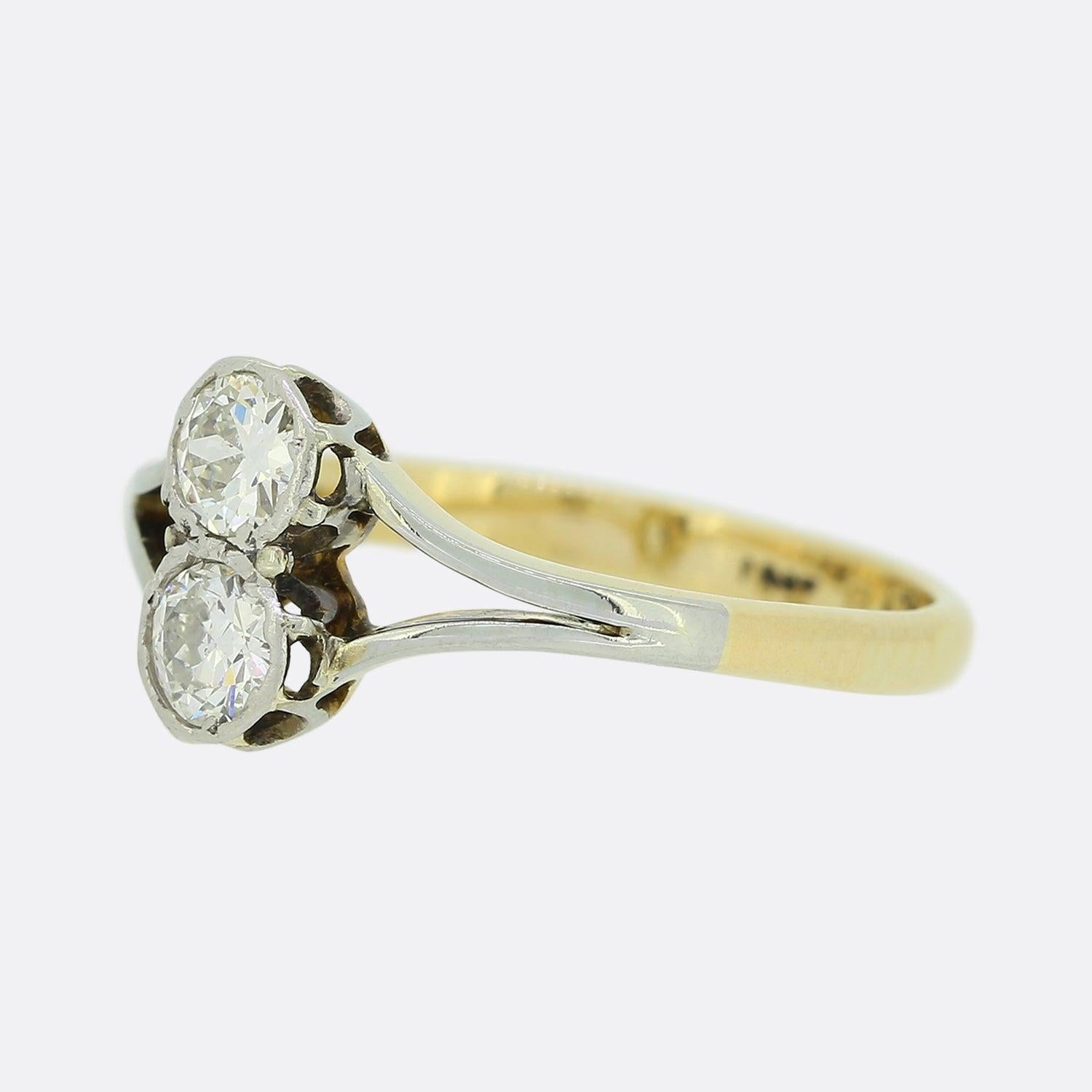 This is an Edwardian diamond two stone crossover ring. The two transitional cut diamonds have been set in rub-over collets and are perfectly matched for colour, clarity and size and have a total weight of 0.40 carats. 

Condition: Used (Very