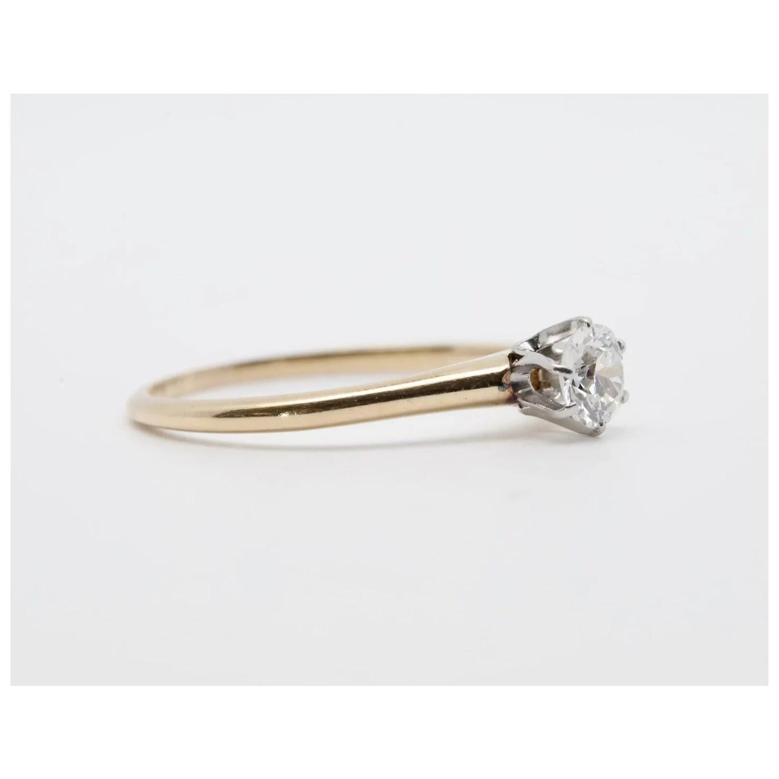 An original Edwardian period old European cut diamond ring in 14 karat yellow gold and platinum. Centered by a 0.45 carat H color SI2 clarity old European cut diamond set in a platinum mount.

In excellent condition, this ring is a size 7US and is