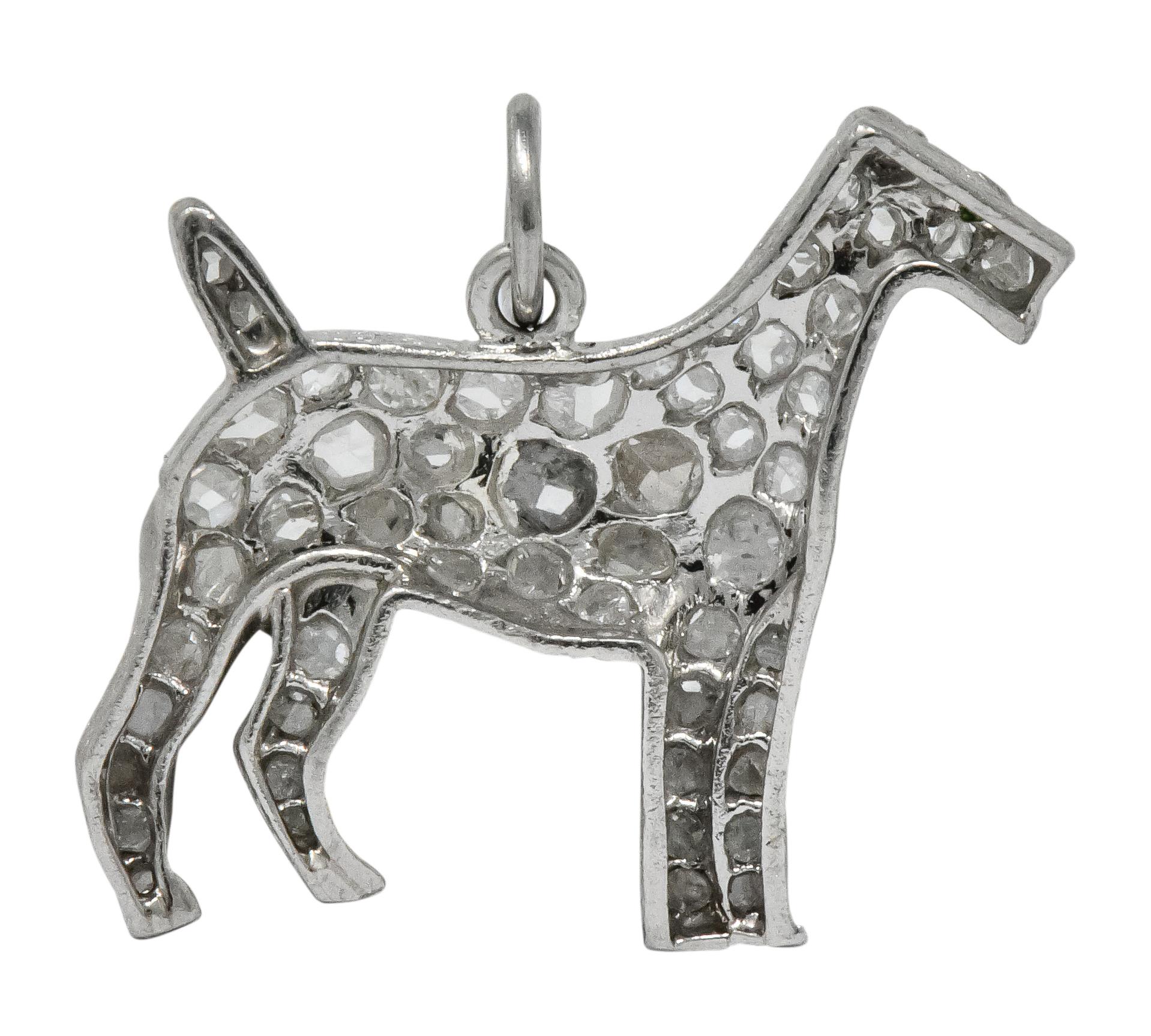 Charm designed as Airedale Terrier with millegrain edges and is pavé set throughout with rose cut diamonds weighing approximately 0.50 carat total

Accented with a green stone eye

Tested as platinum

Circa 1915

Measures: 3/4 x 3/4 inch

Total