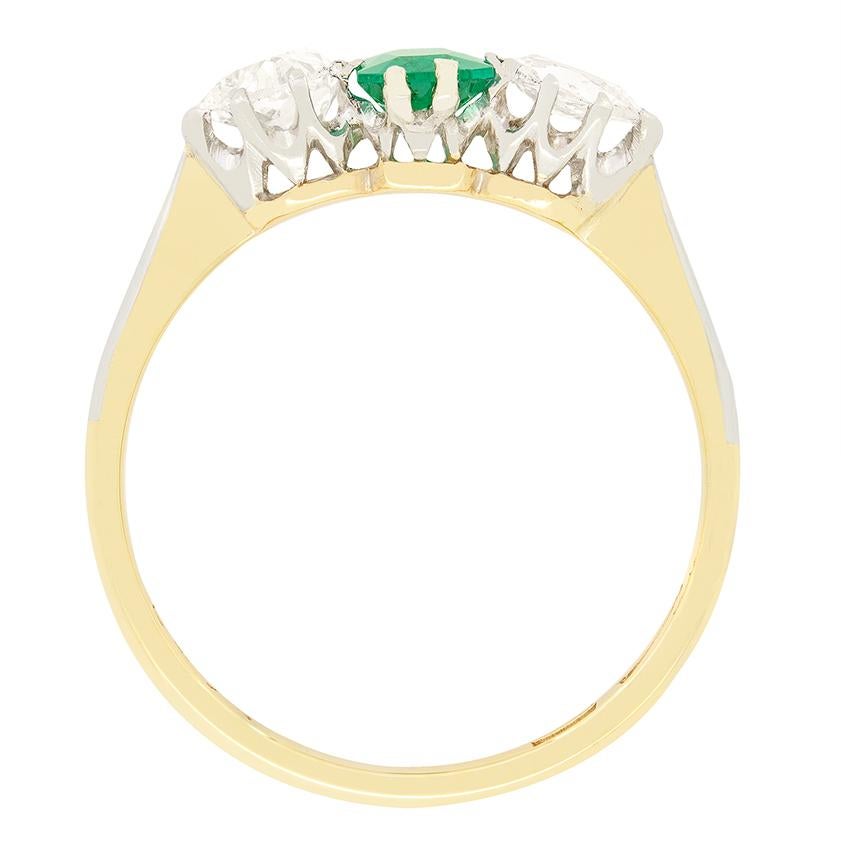 This beautiful trilogy ring, dating back to the Edwardian period, features a vivid 0.50 carat emerald at it’s centre, complemented by two 0.25 carat old pear cut diamonds. Each of the glittering diamond is of exceptional quality matching at F in