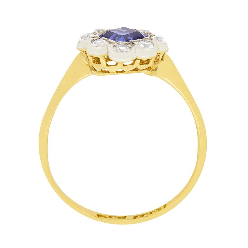 A vibrant blue sapphire is the centre of this one of a kind Edwardian ring. The 0.50 carat sapphire is carre cut, and is a clear violetish blue colour. It is surrounded by 0.24 carat of old cut diamonds. They are G colour and VS clarity. The gems