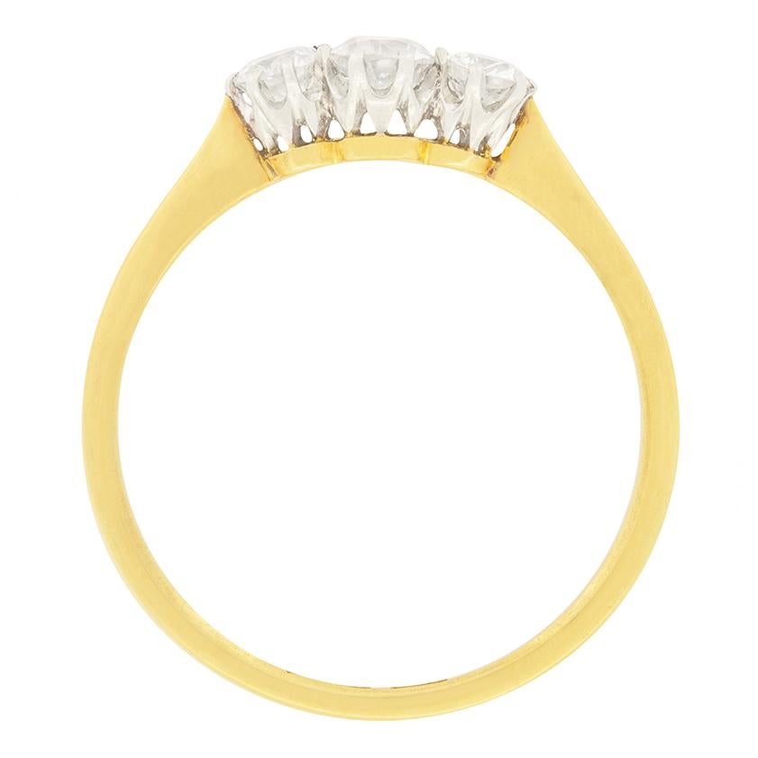 Three old cut diamonds are on display in this sweet trilogy ring from the Edwardian era. In the centre sits the largest of the trio, weighing 0.25 carat, with the diamonds at either end being 0.15 carat each. They have been estimated as H in colour