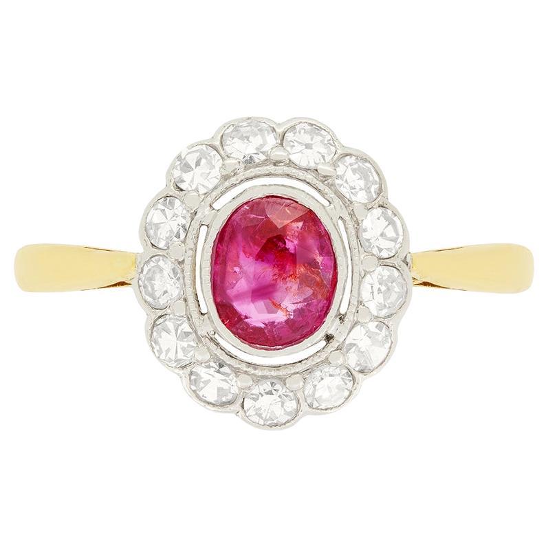 Edwardian 0.55ct Ruby and Diamond Halo Ring, c.1910s For Sale