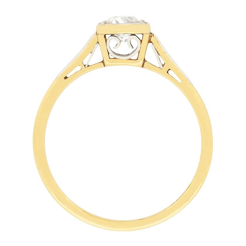 This elegant ring features a single centre stone which weighs 0.56 carat. It has been graded as an F in colour and SI1 in clarity, and is a wonderful, hand cut, old cut diamond. It is held in place by a claw setting, with three refined claws in the