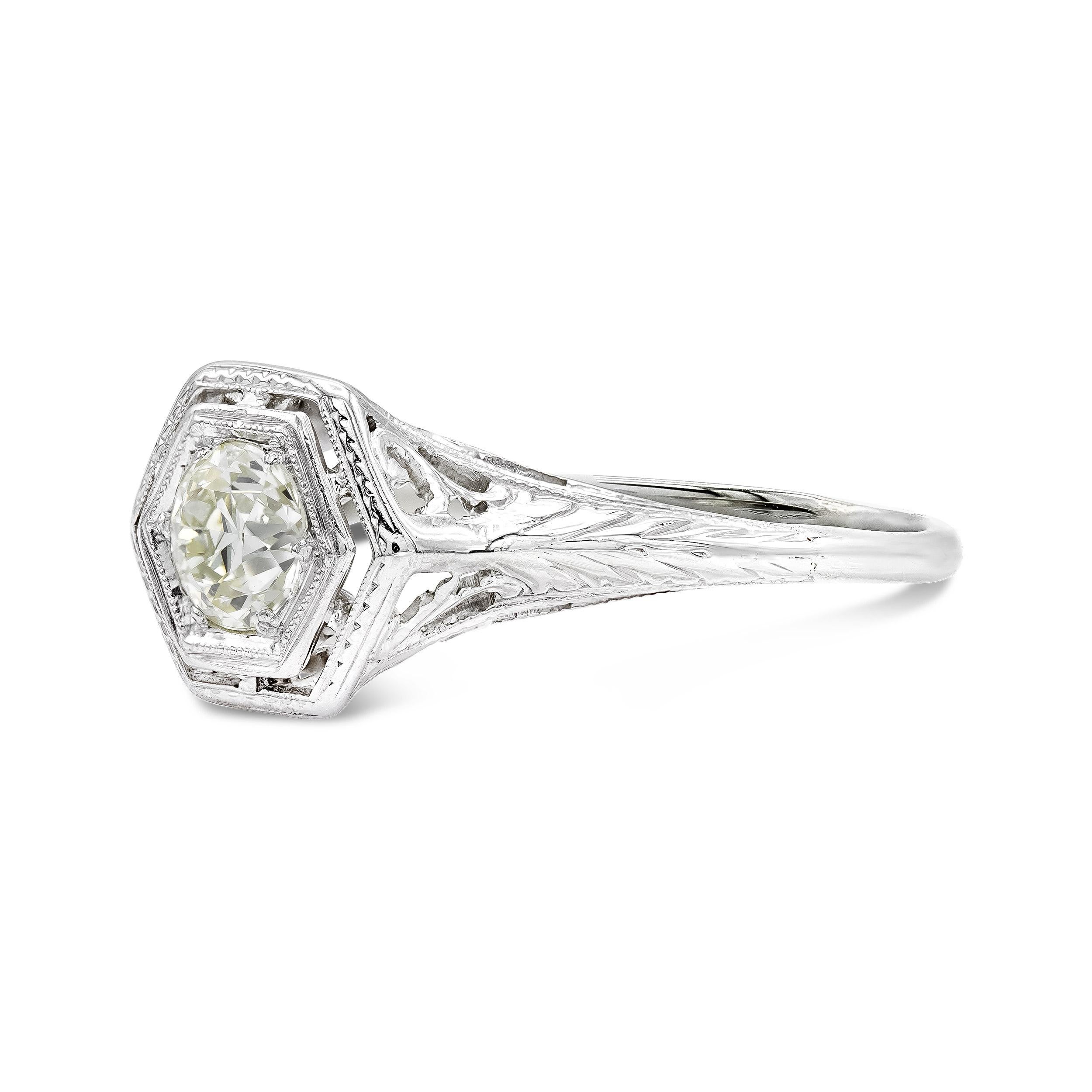 An Edwardian-era engagement ring that proves solitaire settings are anything but simple. Twinkling from the center is a bead-set old European cut diamond in an octagonal setting. The ring is enhanced by the most enchanting pierced filigree design