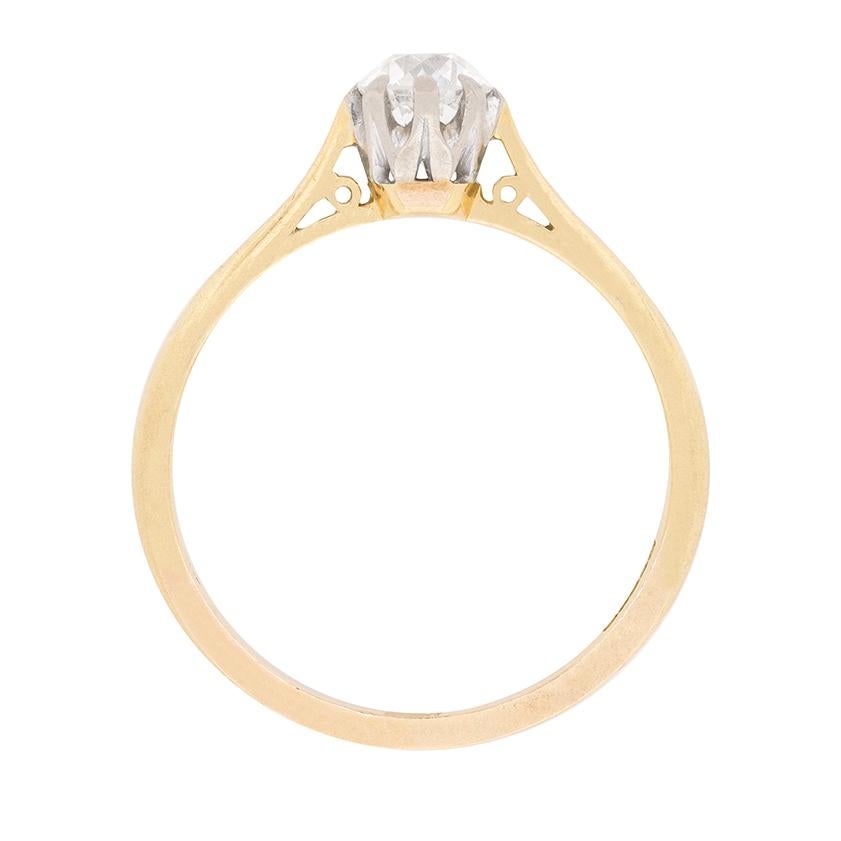 A classic solitaire engagement ring. The diamond is 0.60 carat and has been estimated as a G in colour and VS1 in clarity, and is an old cut diamond. It has been hand cut and beautifully set within the platinum collet in a claw setting. The band is