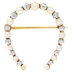 Edwardian 0.62 Carat Diamond Pearl Platinum 14 Karat Gold Horseshoe Brooch