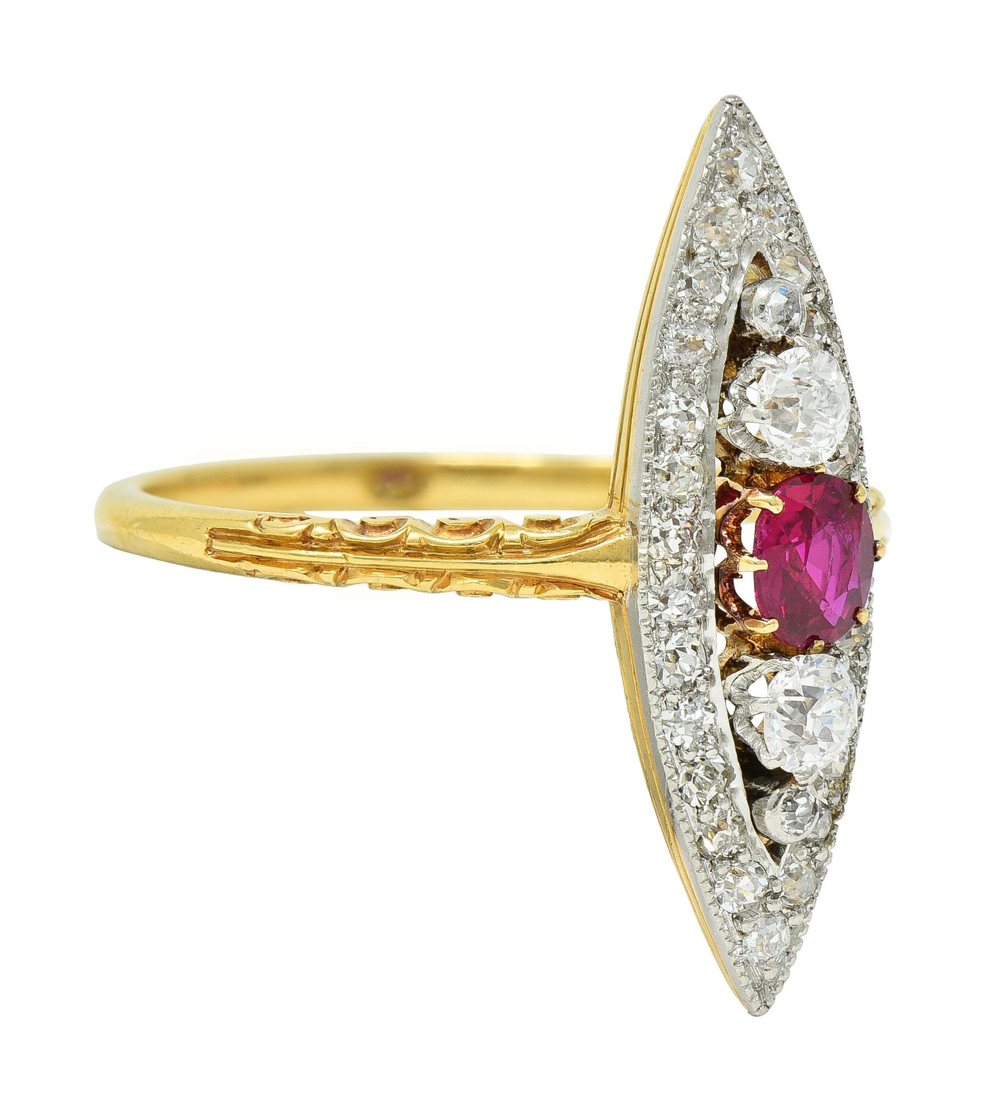 Centering a cushion cut ruby weighing approximately 0.32 carat total - transparent medium red
Prong set and flanked north to south by old European cut diamonds 
Prong and bezel set with a recessed navette-shaped surround 
Bead set throughout with