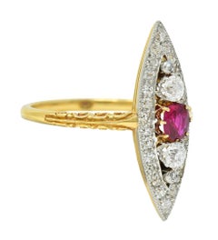Edwardian 0.62 CTW Ruby Diamond Platinum 18 Karat Gold Scroll Navette Ring