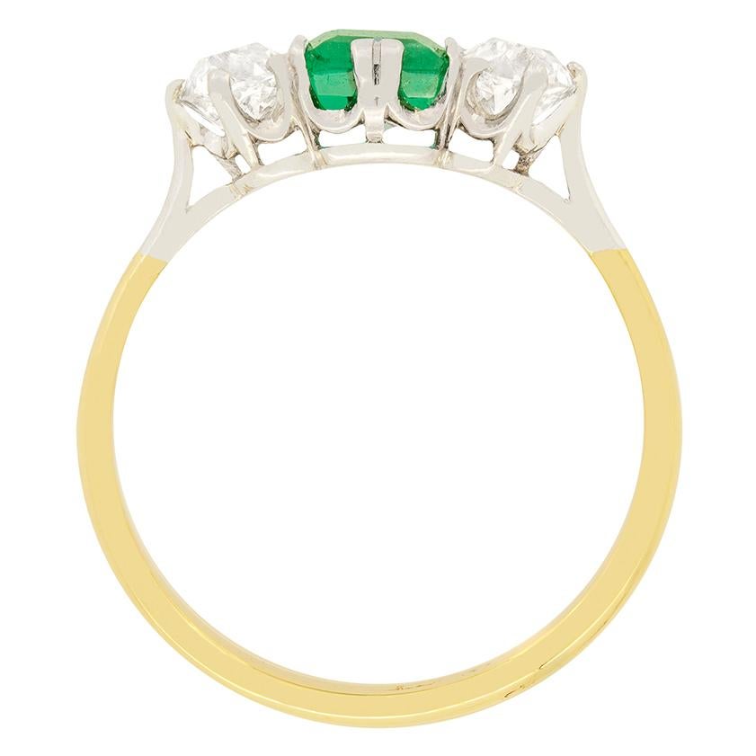 A gorgeous Carre cut diamond is central to this trilogy ring, flanked by two old cut diamonds. The Emerald is 0.65 carat, whilst the diamonds are 0.40 carat a piece. They have been estimated H in colour and VS in clarity. All three stones are