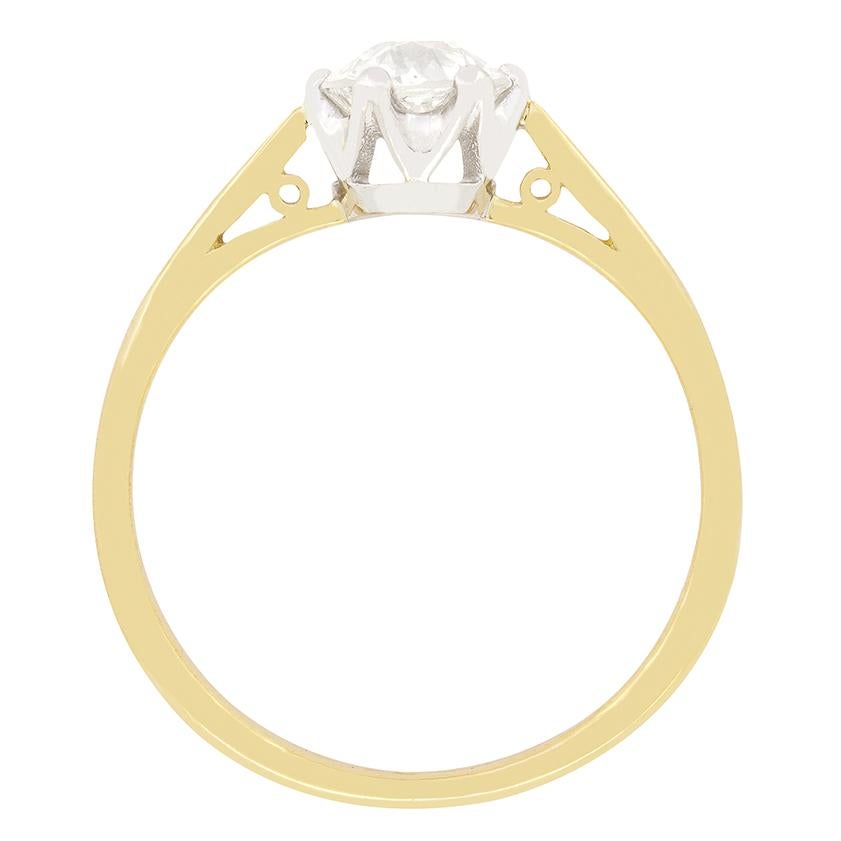 Simple yet timelessly elegant, this Edwardian solitaire ring displays a single 0.70 carat, old cut diamond. The diamond has a colour of H and a clarity of VS1 and is claw set into an open platinum collet, allowing the diamond to come alive. Set on a