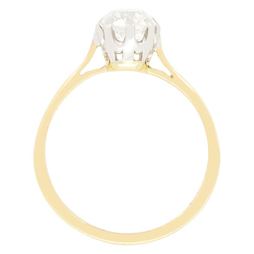 Hand made in the 1910s, this timeless solitaire ring features a single old cut diamond. The 0.70 carat diamond has been graded H in colour and VS1 in clarity. Claw set into a platinum collet on a band of 18 carat yellow gold, this wonderful