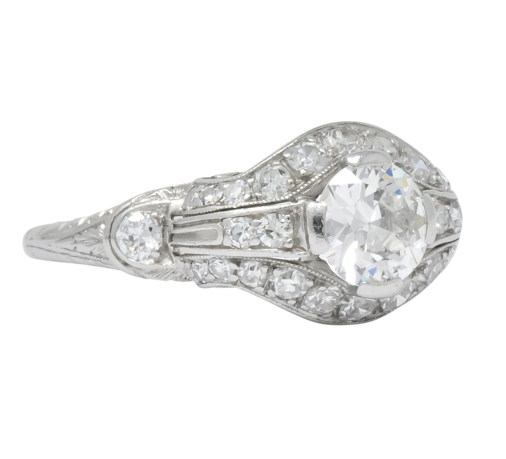 Centering a transitional cut diamond weighing approximately 0.60 carat, H color and VS clarity

Surrounded by single cut diamonds with two transitional cut diamonds at the shoulders, all weighing approximately 0.20 carat, H/I color and VS