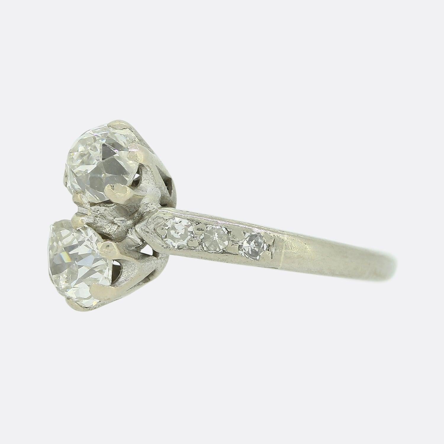 This is an Edwardian diamond two stone crossover ring. The two old cut diamonds have been set in a six claw collet are perfectly matched for colour, clarity and size and have a total weight of 0.80 carats.

Condition: Used (Very Good)
Weight: 2.1