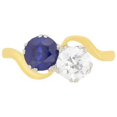 Antique Edwardian 0.85 Carat Diamond and Sapphire Two-Stone Twist Ring, circa 1910s