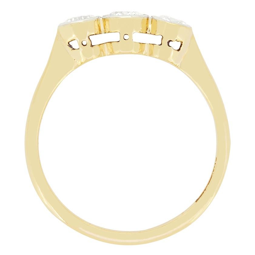 A trio of rub over set, old cut diamonds are on display in this wonderful Edwardian trilogy ring. The largest of the trio sits central at 0.35 carat and the two flanking stones being 0.25 carat each. All three match in quality at G in colour and VS2