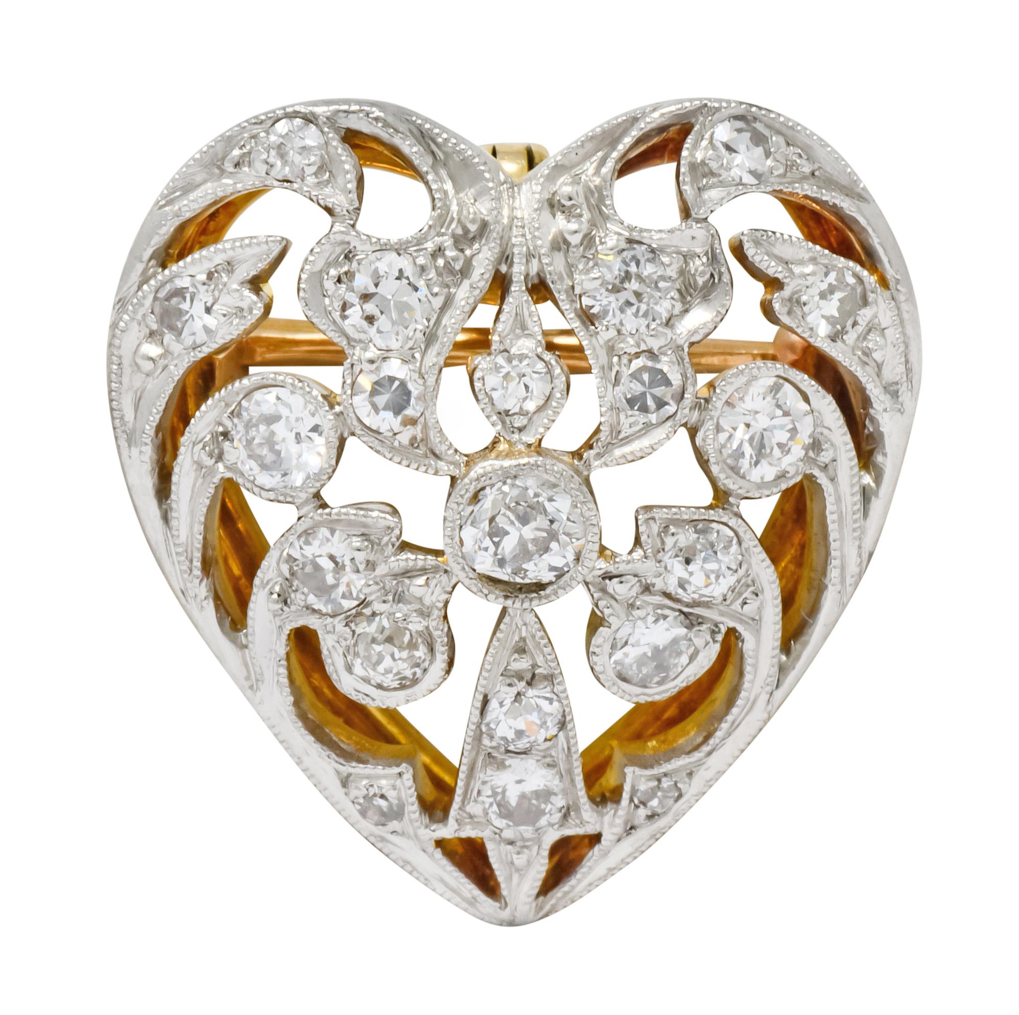 Pendant brooch designed as pierced out heart with lace-like design and milgrain edge detail

Set throughout by old European cut and single cut diamonds weighing approximately 0.90 carat; G to I color and VS to SI clarity

Completed by pin stem with