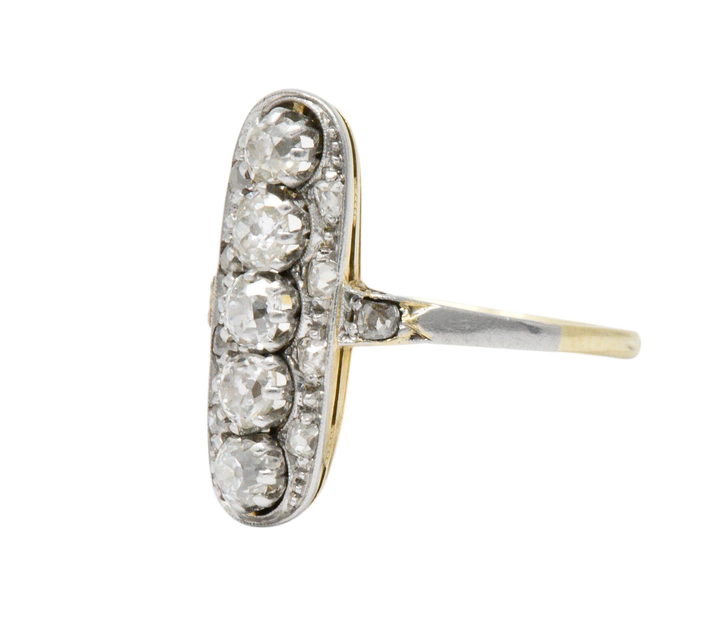 Dinner style ring with an elongated shape featuring five old mine cut diamonds, claw set in a row, North to South

Surrounded by bead set rose cut diamond accents

Total diamond weight is approximately 0.90 carat; G to J color with VS to SI