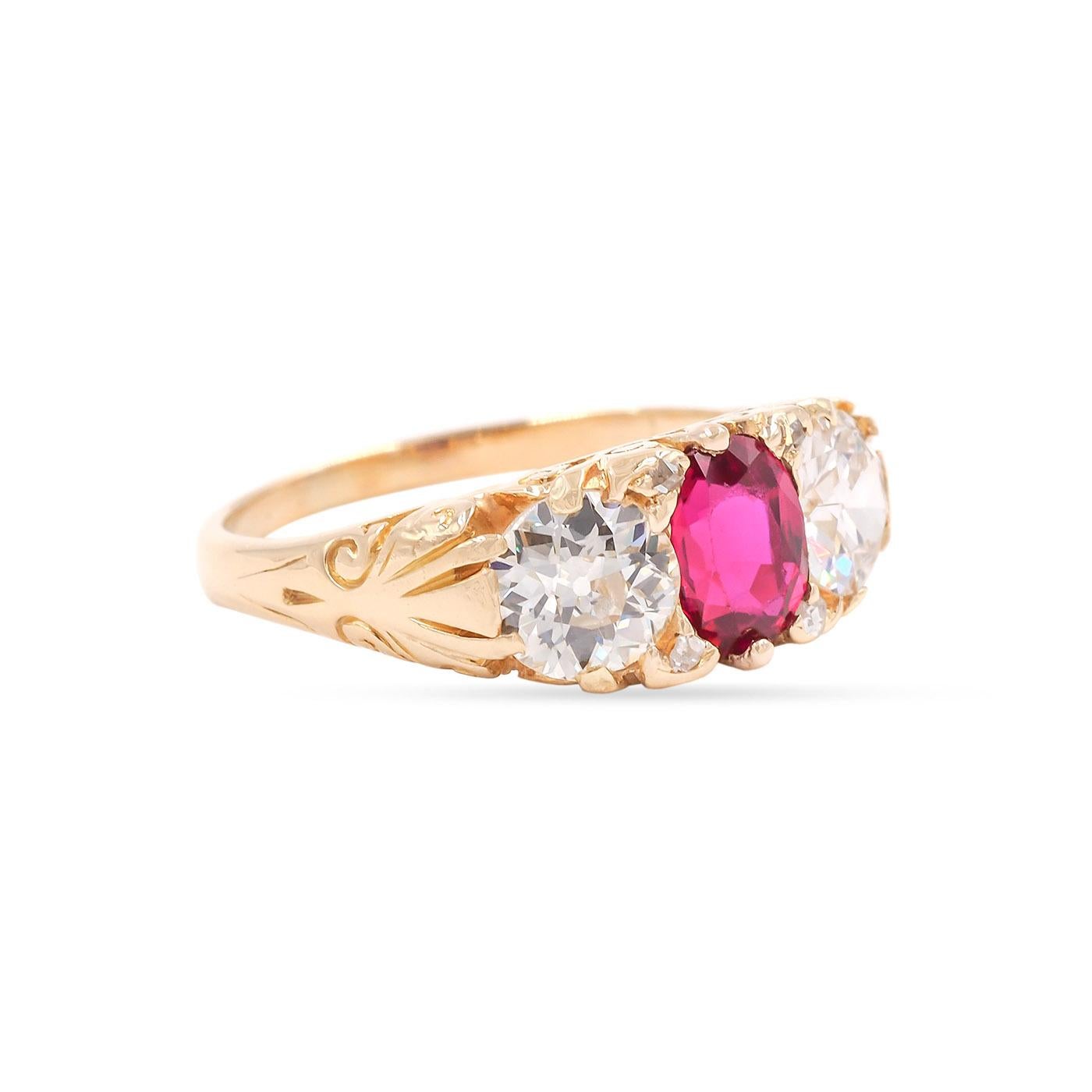 Edwardian era 0.91 Carat Oval Cut Ruby & Old European Cut Diamond 3-Stone Ring composed of 18k yellow gold. The center 0.91 carat Oval Cut ruby is Non-Heat Treated and flanked by two Old European Cut diamonds weighing approximately 1.21 carats in