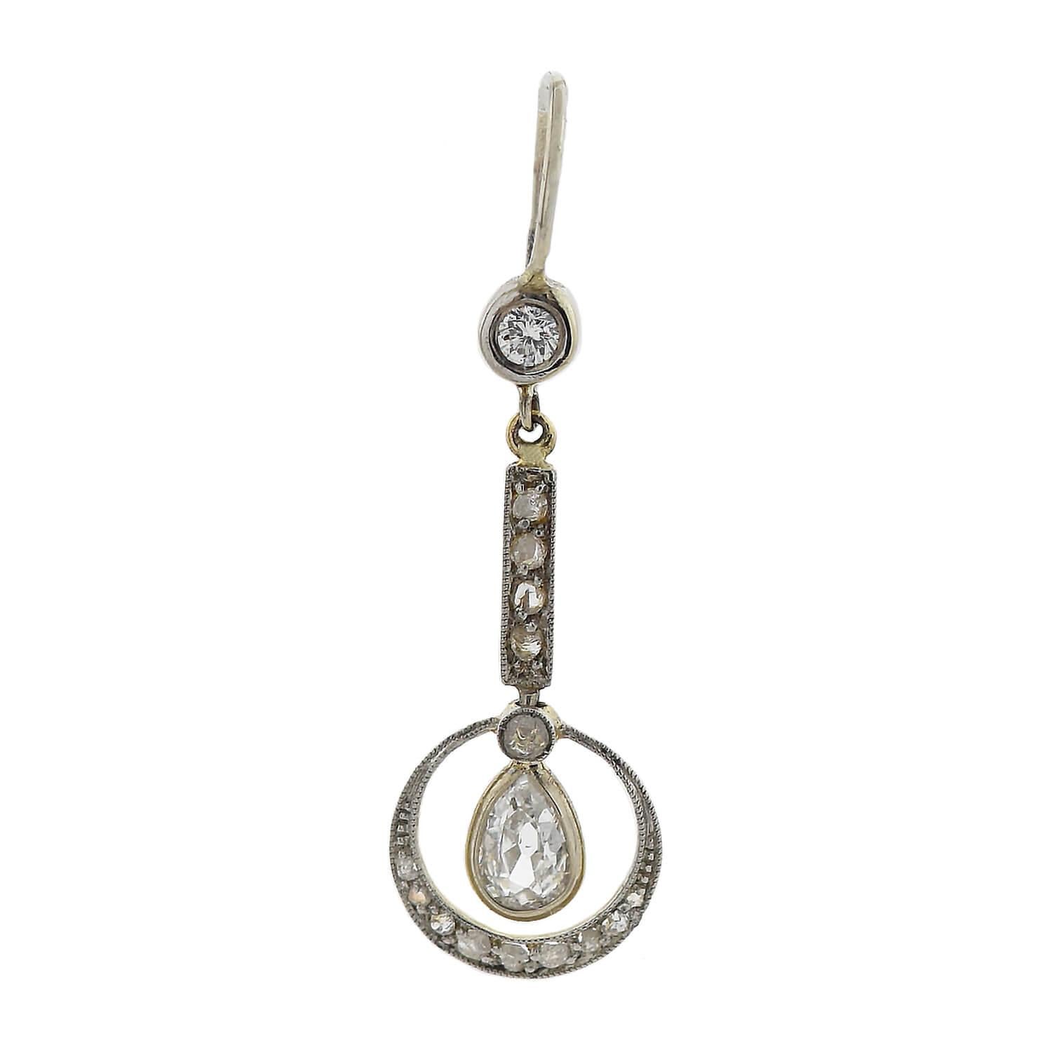 A beautiful pair of diamond earrings from the Edwardian (ca1910s) era! Crafted in platinum-topped 14kt yellow gold, these diamond-encrusted earrings have a lovely dangling design. Each hangs from a 14kt gold wire which attaches at a bezel set
