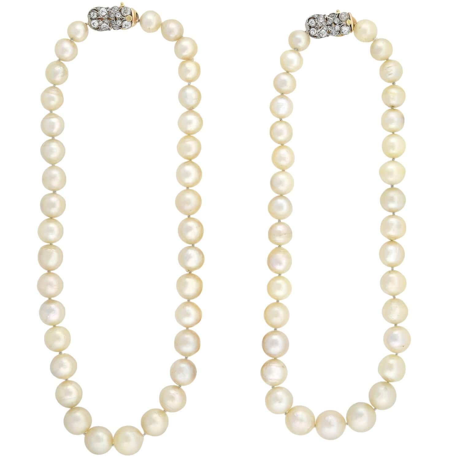 A classically beautiful and very unique South Sea Pearl convertible necklace with gorgeous Edwardian (ca1910s) era diamond clasps! This fabulous piece is comprised of a single strand of substantially sized pearls which can convert to be worn as two