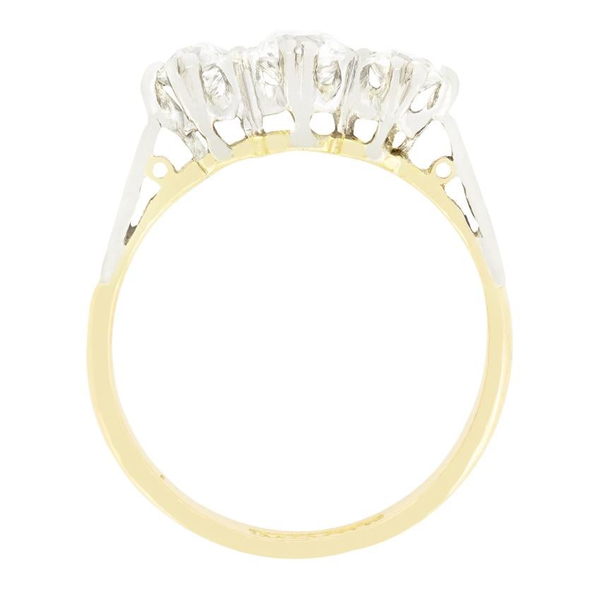 A trio of beautiful old cut diamonds are on display in this stunning Edwardian three stone ring. To the centre sits a 0.50 carat old cut diamond, flanked a pair of 0.25 carat diamonds. All three diamonds match in quality at G in colour and VS in
