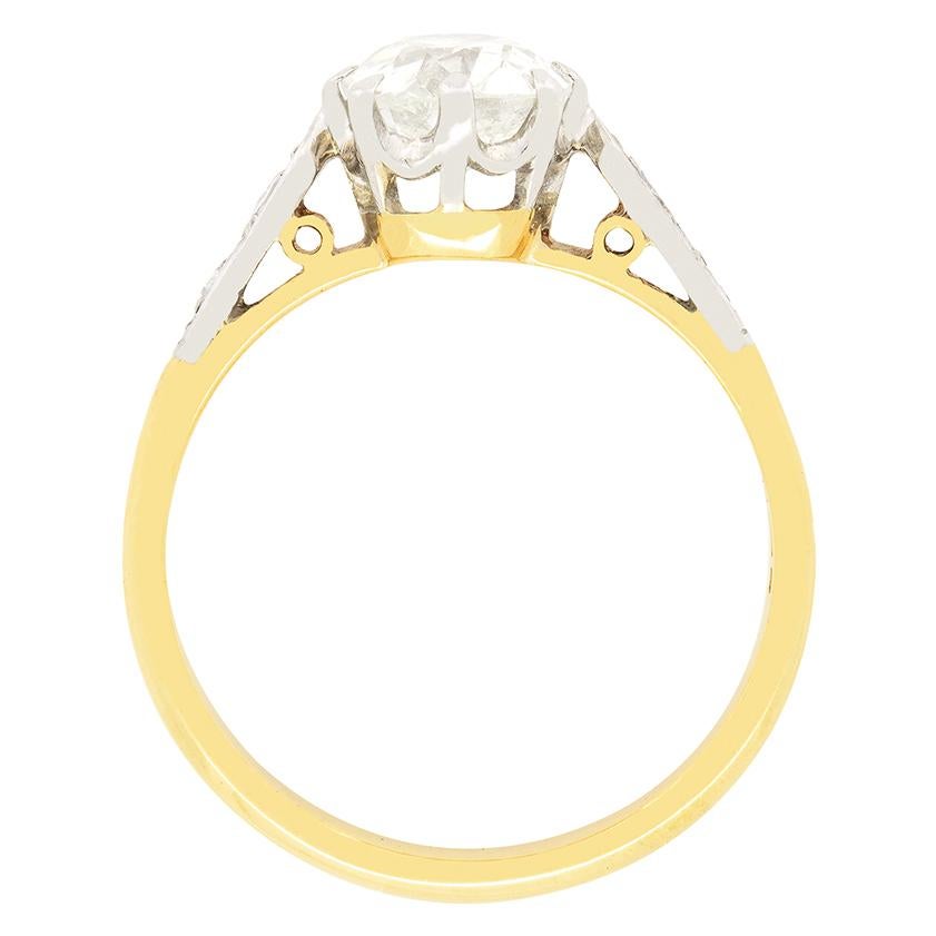 Dating back to the Edwardian era, this quintessential engagement ring features a 1.01 carat old cut diamond at its centre. The diamond has been given an estimated grading of J in colour and SI2 in clarity. The beautifully hand crafted platinum